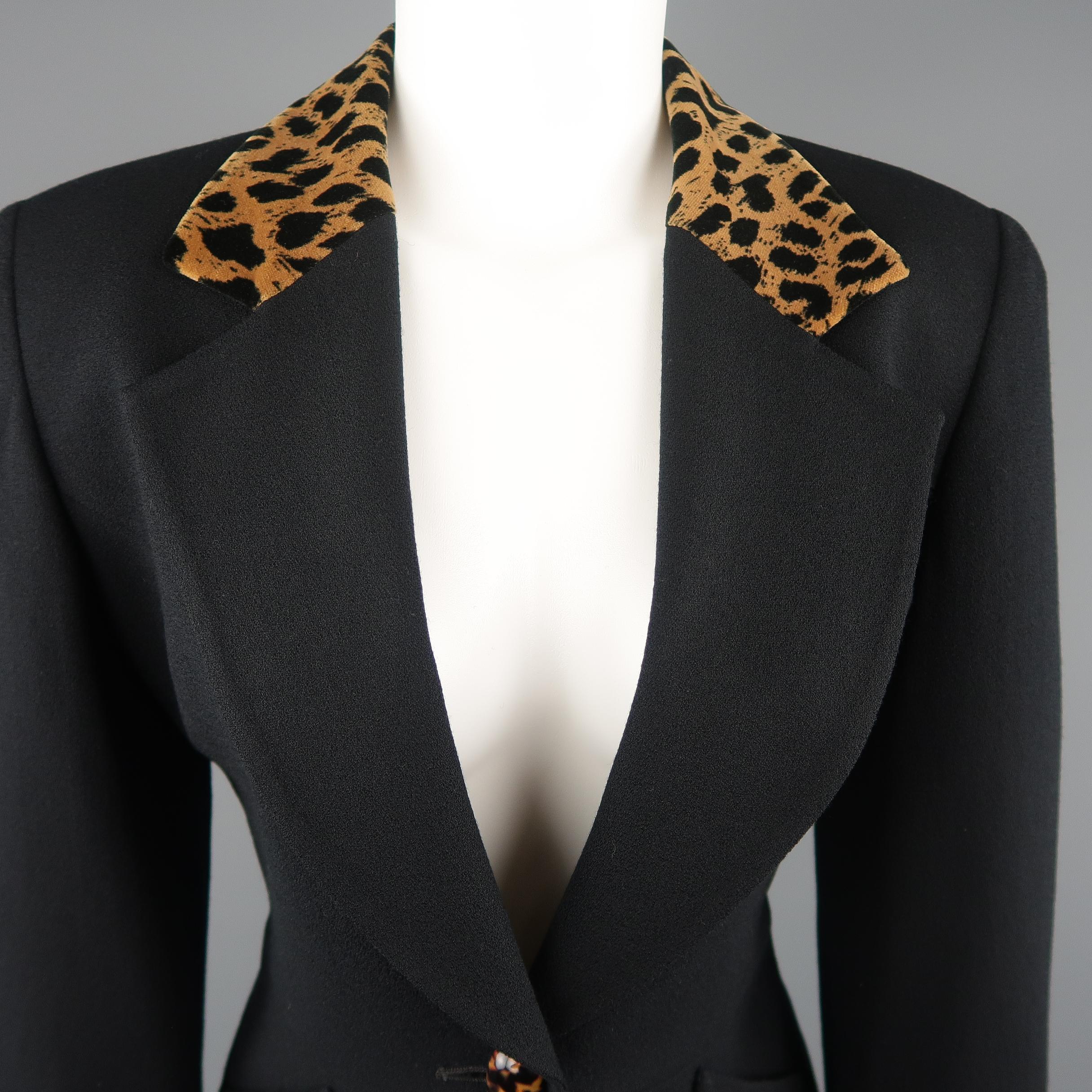 Vintage CHRISTIAN DIOR cropped jacket comes in black wool crepe with a pointed lapel, single button closure, slanted pockets, and cheetah print velvet collar. Made in USA.
 
Excellent Pre-Owned Condition.
Marked: 4
 
Measurements:
 
Shoulder: 16