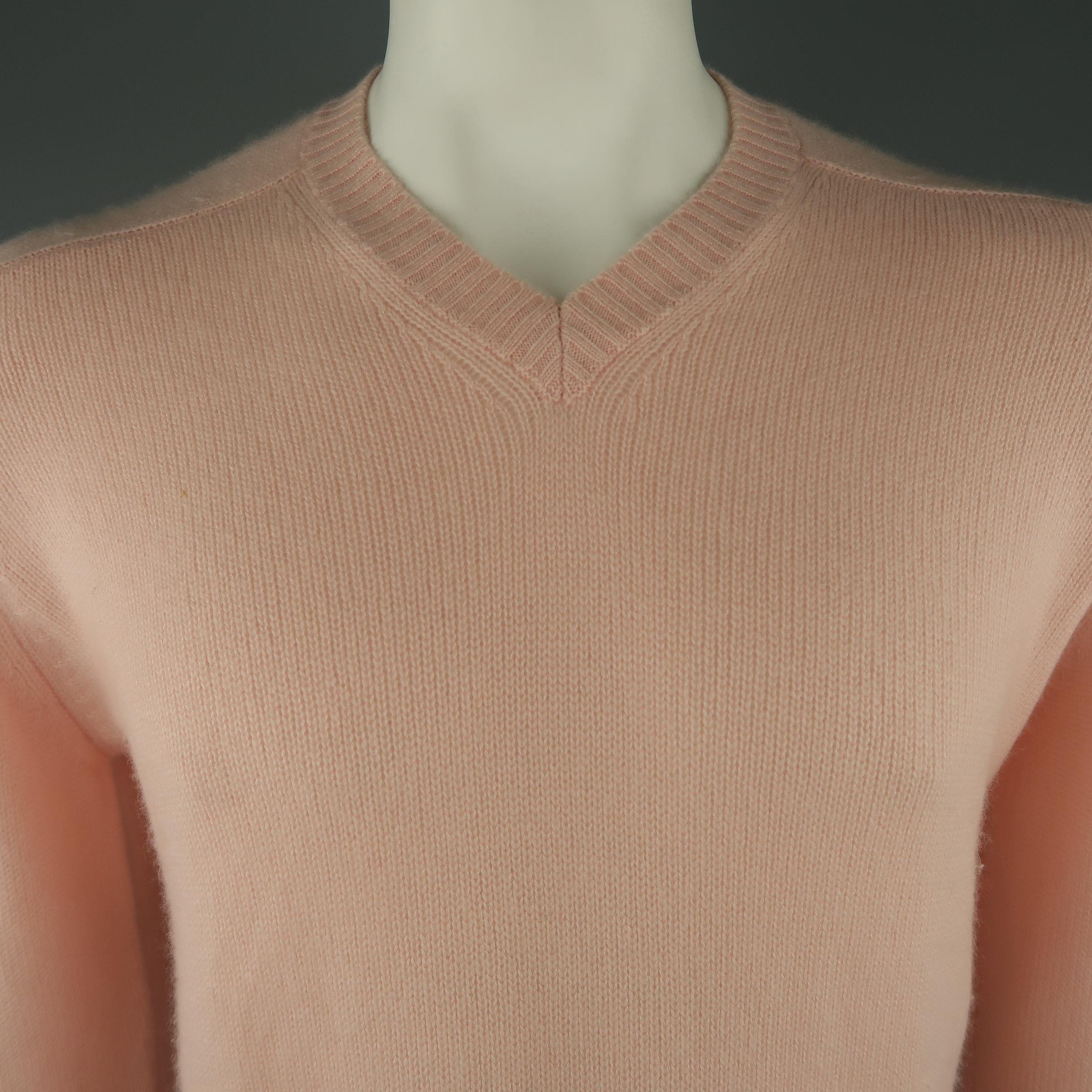 BRUNELLO CUCINELLI sweater come in a light pink  tone,  knitted cashmere material, with a V-neck, ribbed cuffs and waistband. Made in Italy.
 
Excellent Pre-Owned Condition.
Marked: 50 IT
 
Measurements:
 
Shoulder: 17.5 in.
Chest: 45 in.
Sleeve: 28