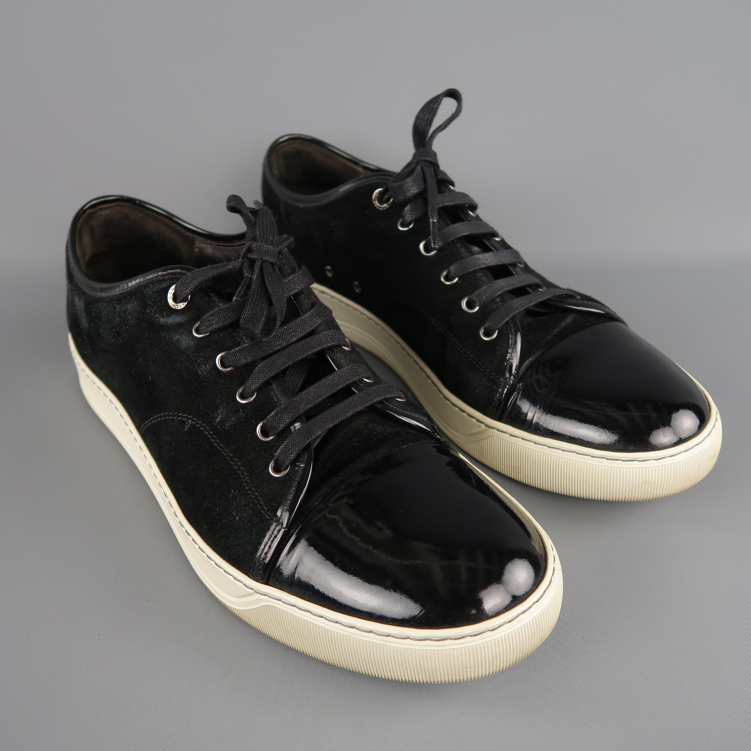 LANVIN soft black suede low-top sneakers are styled with a patent leather cap toe. As-Is. Made in Portugal.
 
Very good Pre-Owned Condition.
Marked: Lanvin UK 12
 
Outsole: 13 x 3 in.  
