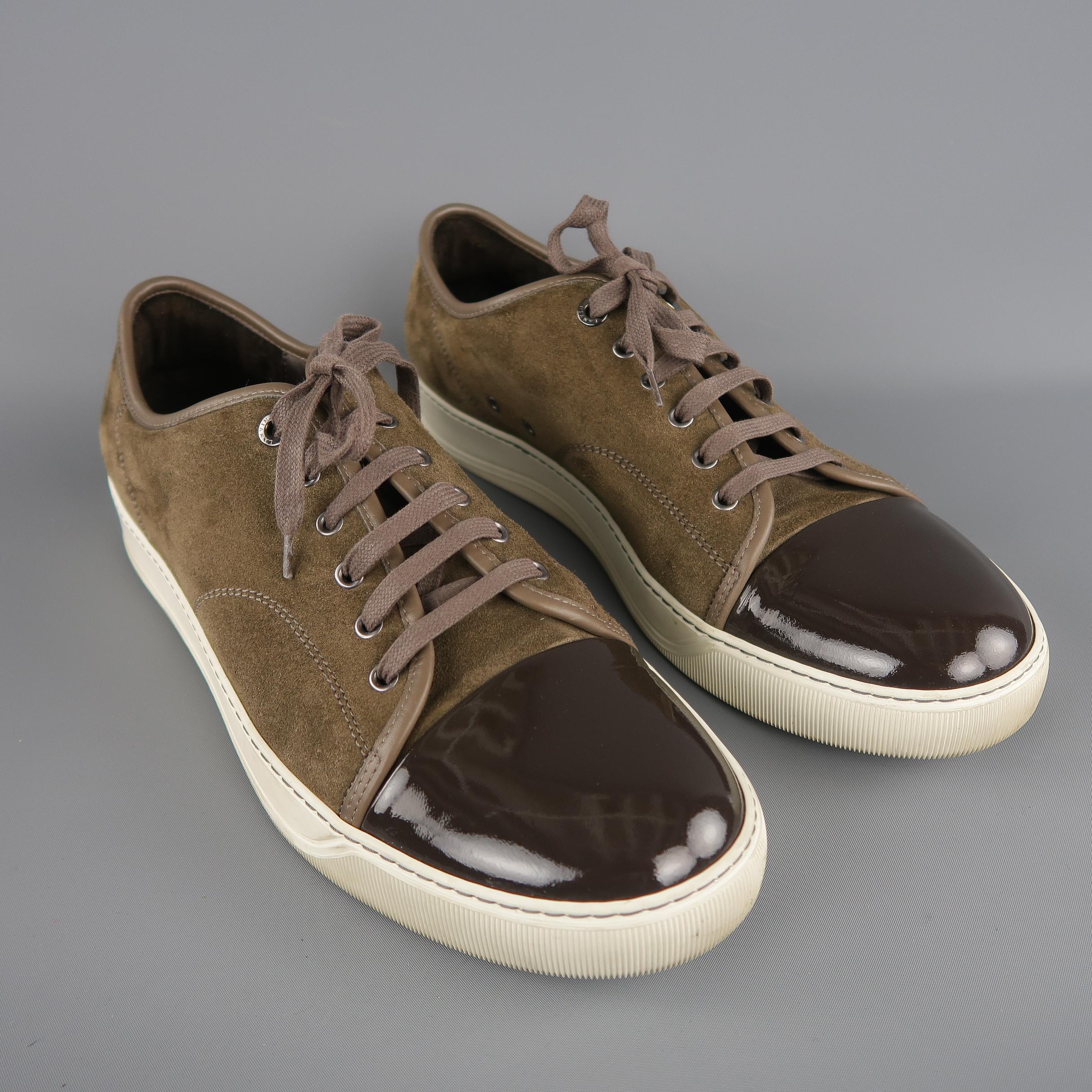 LANVIN soft taupe suede low-top sneakers are styled with a patent leather cap toe. As-Is. Made in Portugal.
 
Very good Pre-Owned Condition.
Marked: Lanvin UK 12
 
Outsole: 13 x 3 in.  