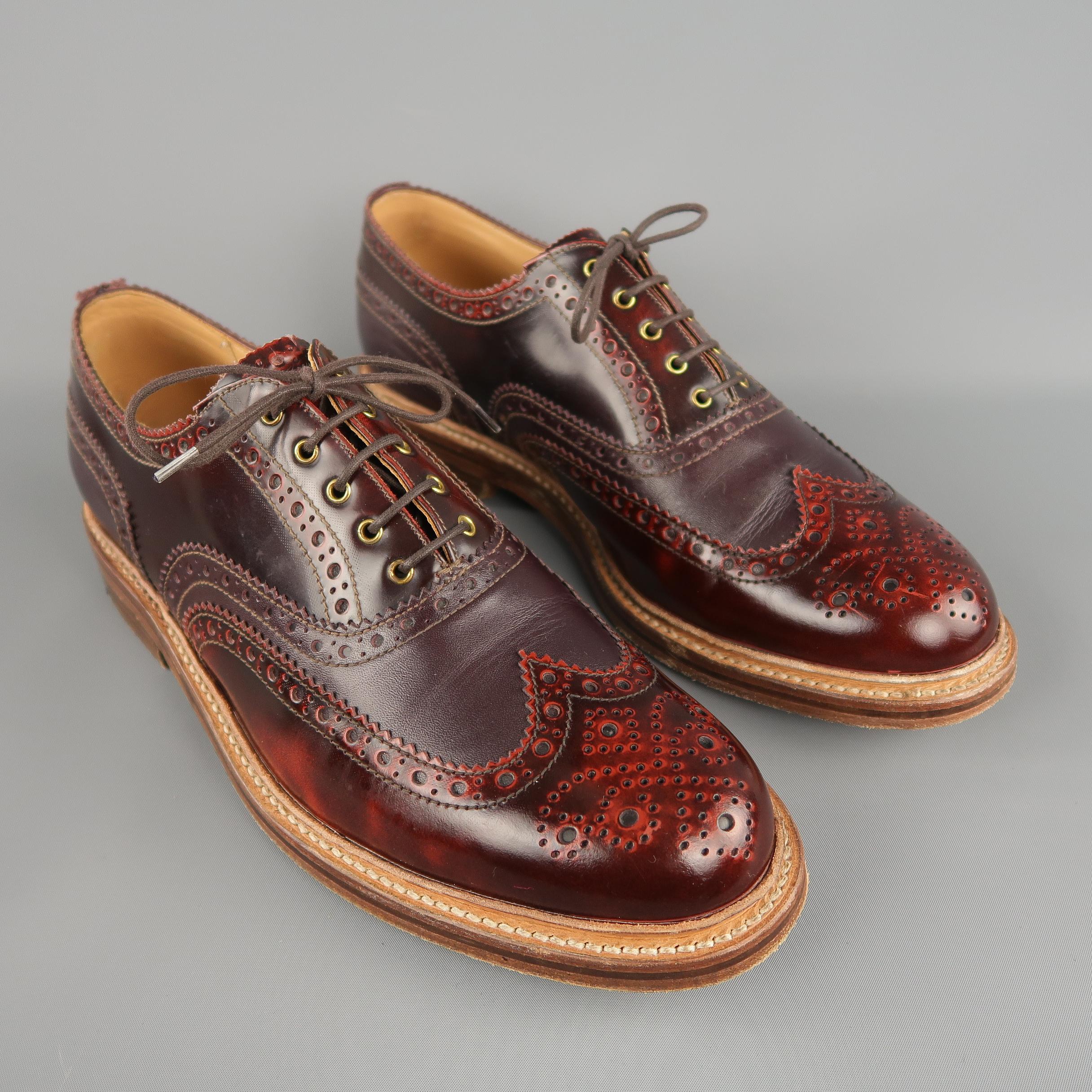 GRENSON brogue shoes come in burgundy tones of leather, wingtip-style and perforations. 

Made in England. 
Excellent Pre-Owned Condition
Marked: 11 G UK
 
Measurements:
Outsole: 13 x 3 in.