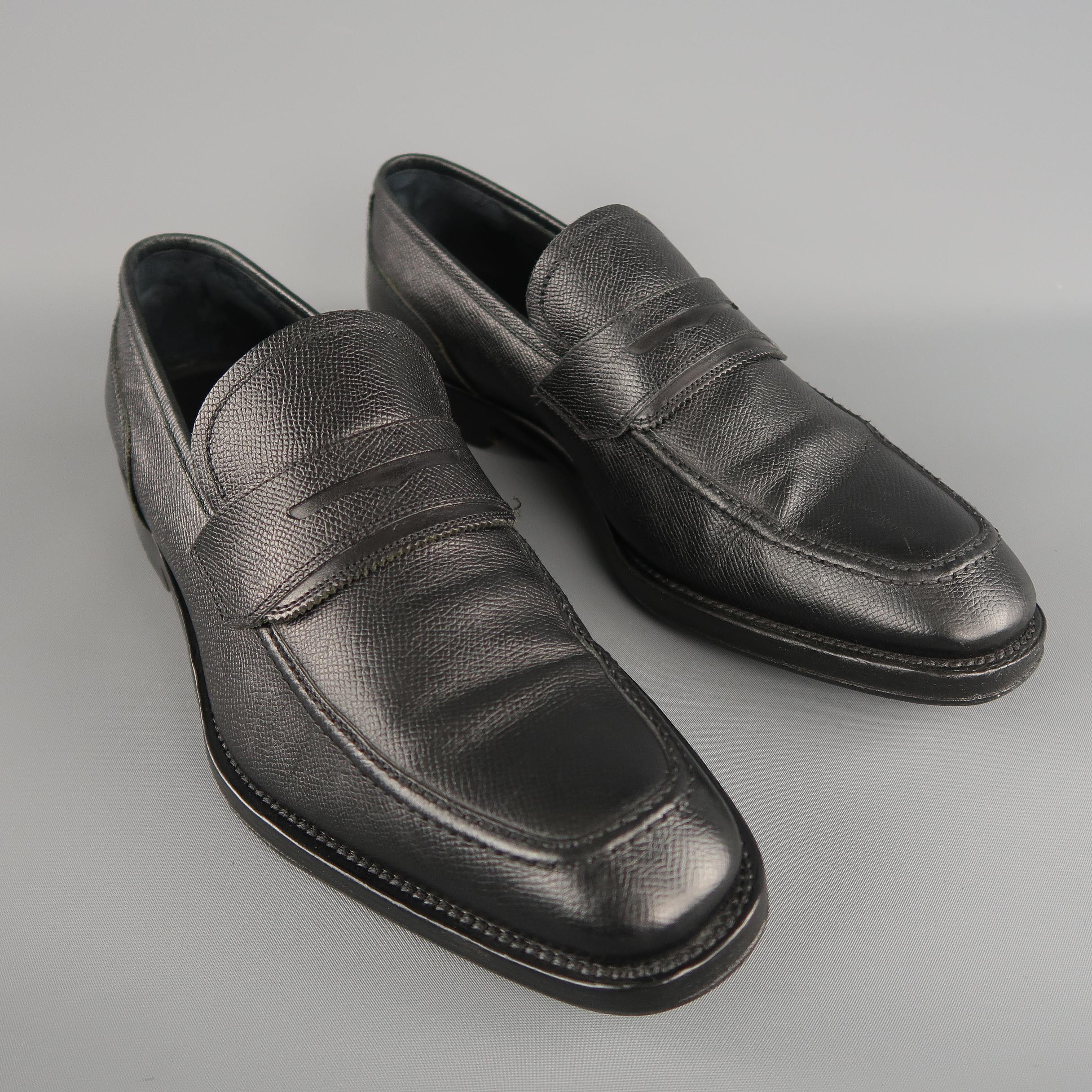 SALVATORE  FERRAGAMO slip-on loafers come in black color in grain leather material. Added non slip sole. 

Made in Italy. 
Excellent Pre-Owned Condition
Marked: 9 UK
 
Measurements:
Outsole: 12 x 2.5  in.
