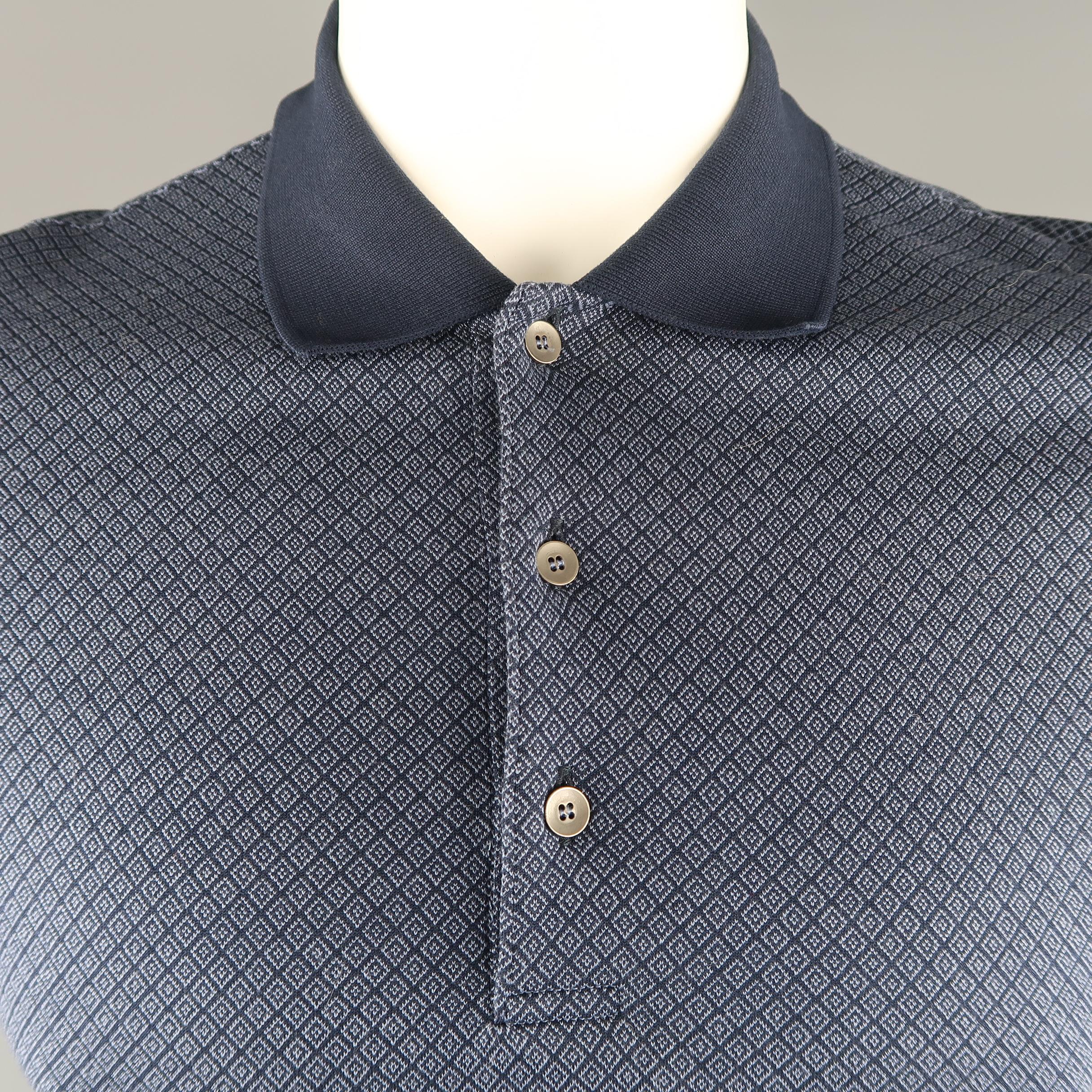BOTTEGA VENETA POLO shirt features a navy tone rhombus print in woven cotton, button down front and a mix of fabrics. 

Made in Italy. 
Excellent Pre-Owned Condition.
Marked: 50 IT
 
Measurements:
 
Shoulder: 17  in.
Chest: 41 in.
Sleeve: 8.5 