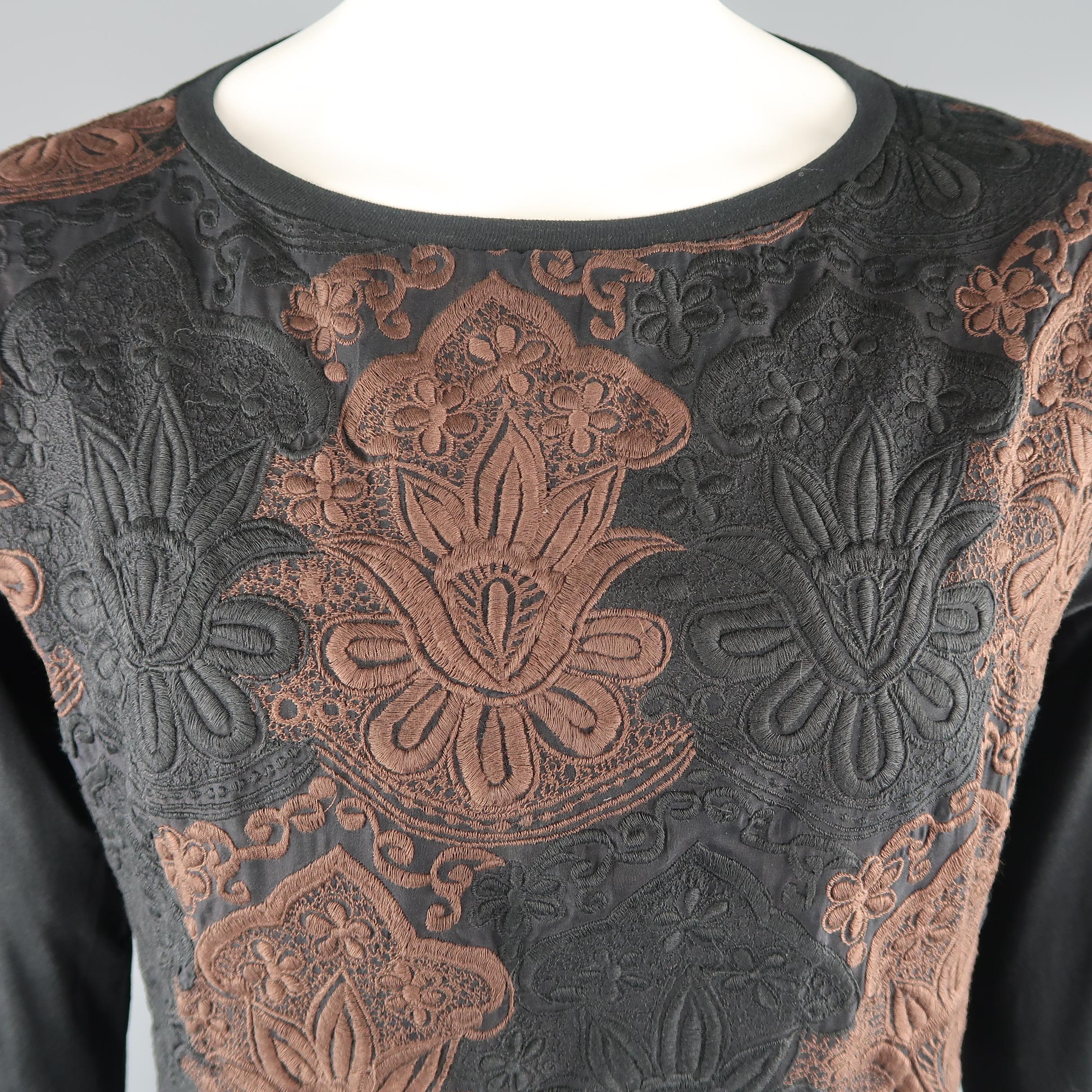 DRIES VAN NOTEN long sleeve pullover comes in a black cotton and silk, with embroideries in black and brown and crew neck.
 
Excellent  Pre-Owned Condition.
Marked: S
 
Measurements:

    Shoulder: 17.5  in.
    Chest: 45 in.
    Sleeve: 27.5  in.
 