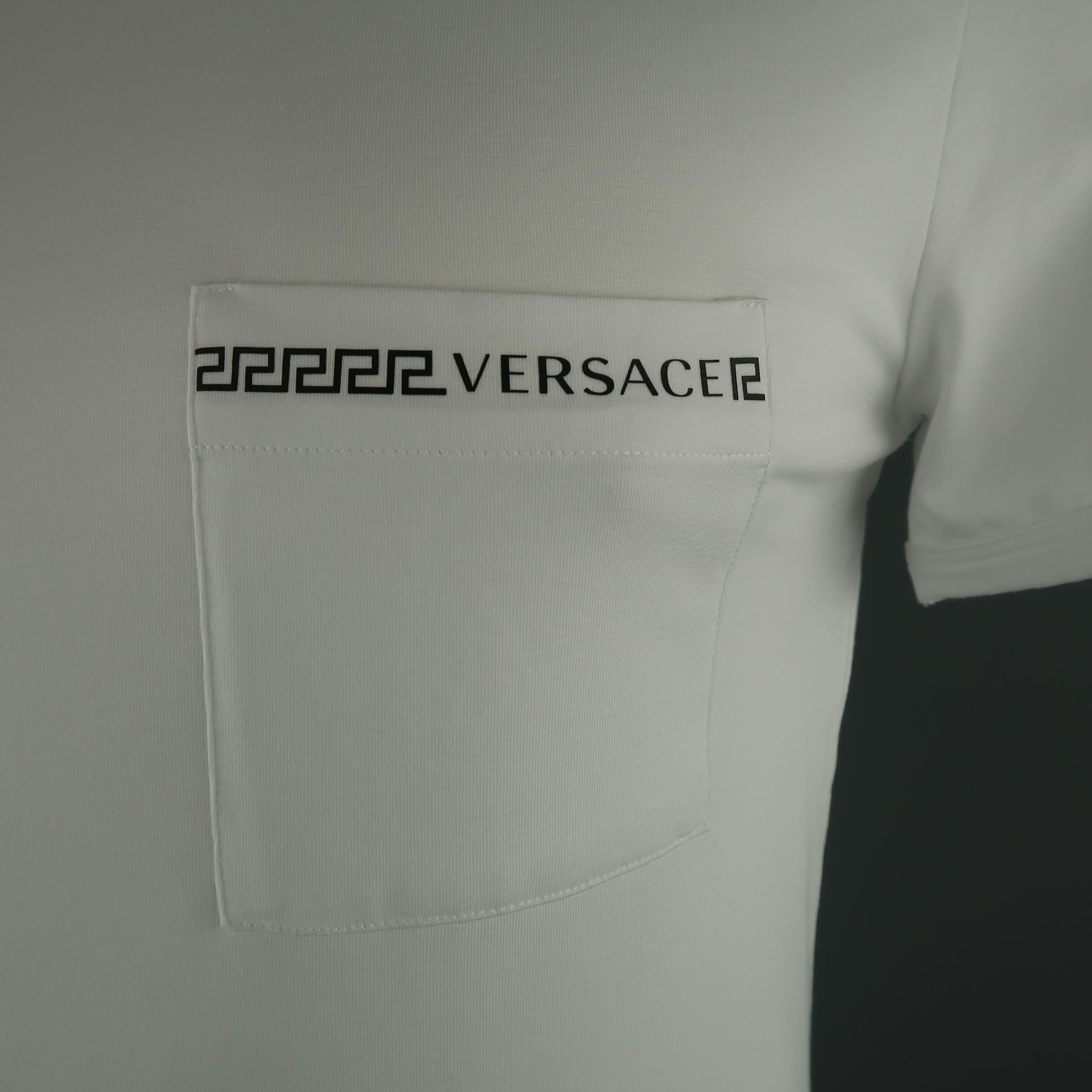 VERSACE classic T-shirt come in white cotton, with patch pocket on the chest, and crewneck. Presenting dust mark on the left shoulder.  
 
New with tags.
Marked: 6
 
Measurements:
 
Shoulder: 17 in.
Chest: 40 in.
Sleeve: 8 in.
Length: 28.5  in.