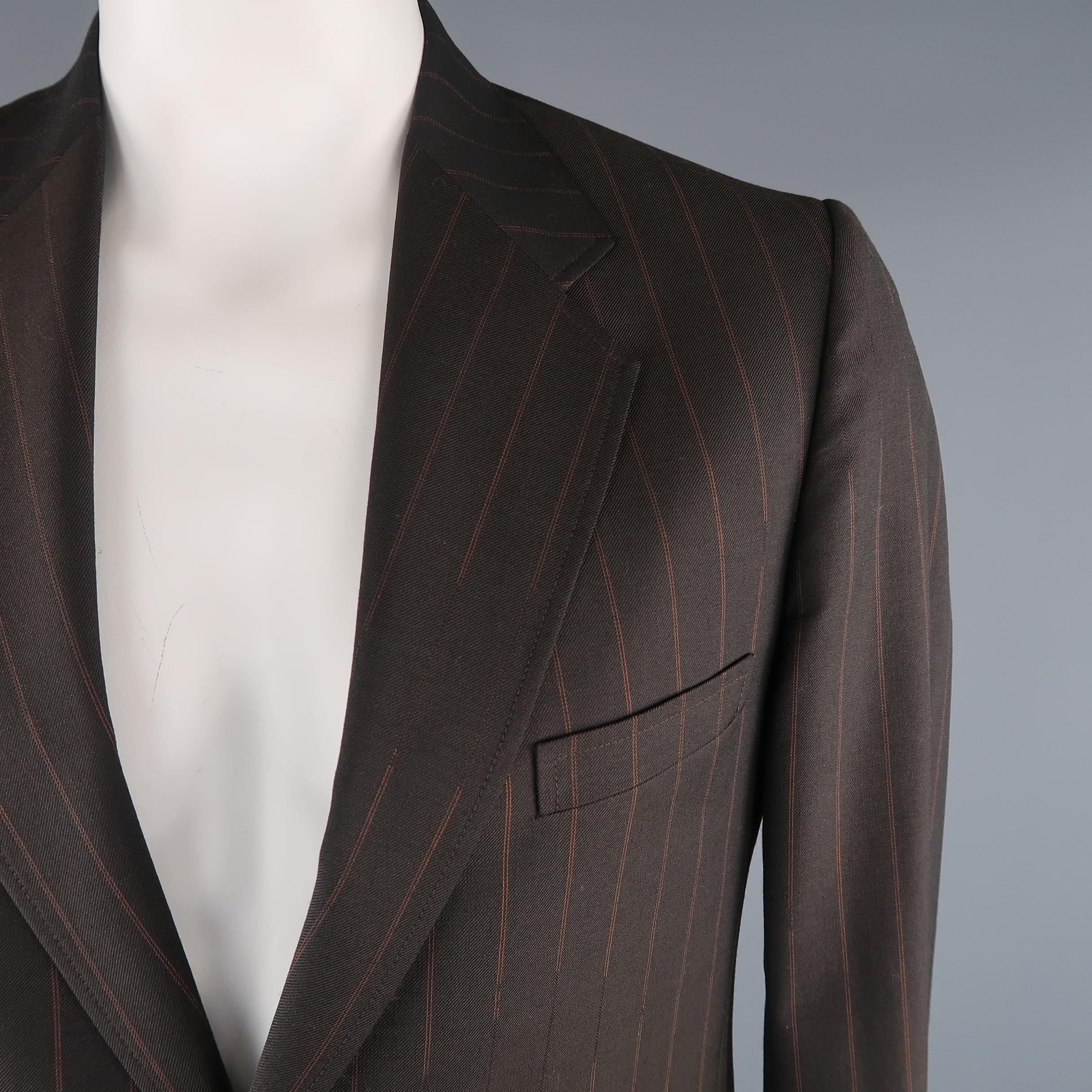 MAISON MARTIN MARGIELA sport coat come in brown striped wool, notch lapel, 2 buttons, flap pockets, single vent on the hem back and functional buttons on the cuff. Made in Italy.
 
Excellent  Pre-Owned Condition.
Marked: 52 IT
 
Measurements:
