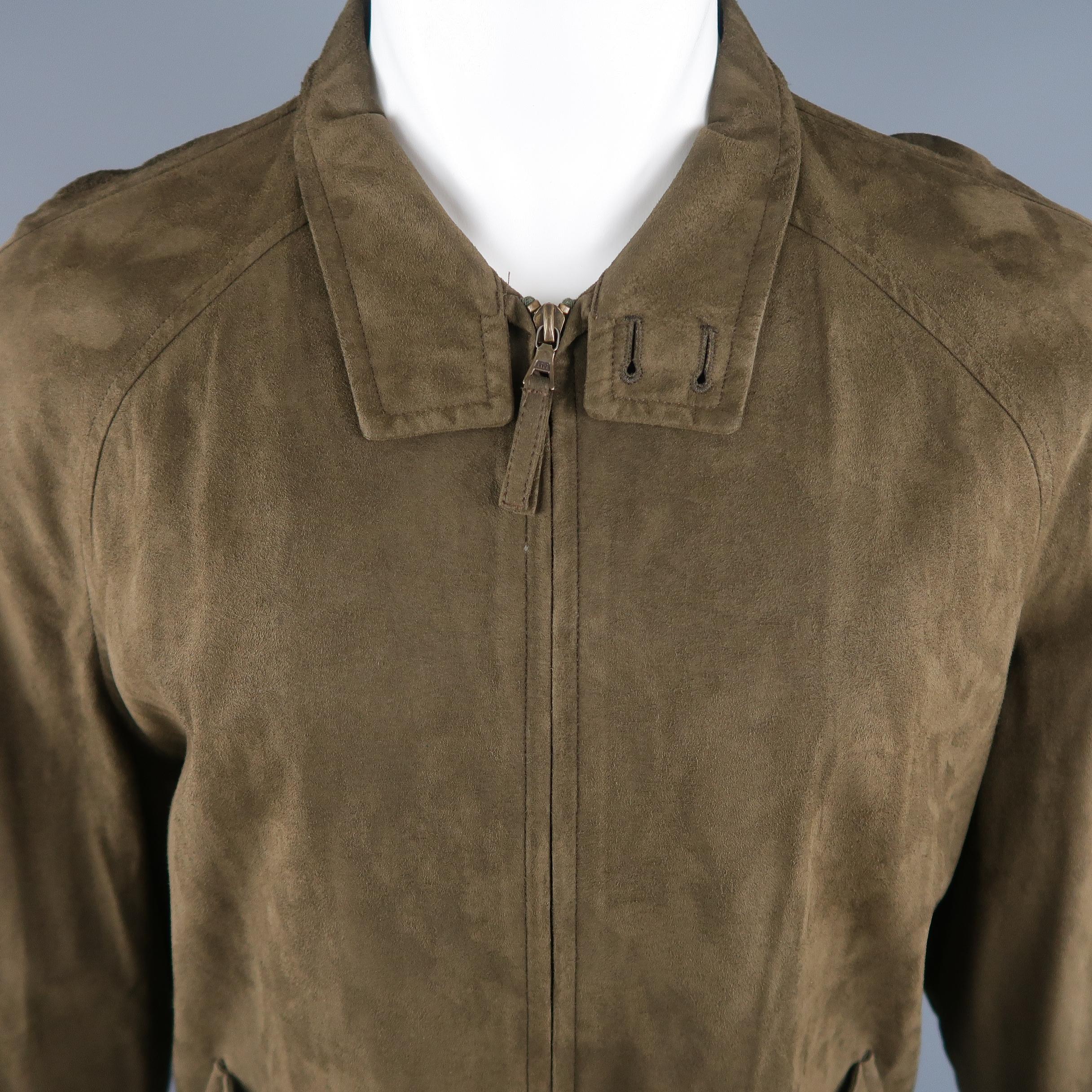 ERMENEGILDO ZEGNA jacket come in olive solid polyamide faux suede, with buttoned collar, zip up and buttoned flap pockets. Coat hanger marks on the shoulders. Made in Italy.
 
Good Pre-Owned Condition.
Marked: M / 50
 
Measurements:
 
Shoulder: 17.5