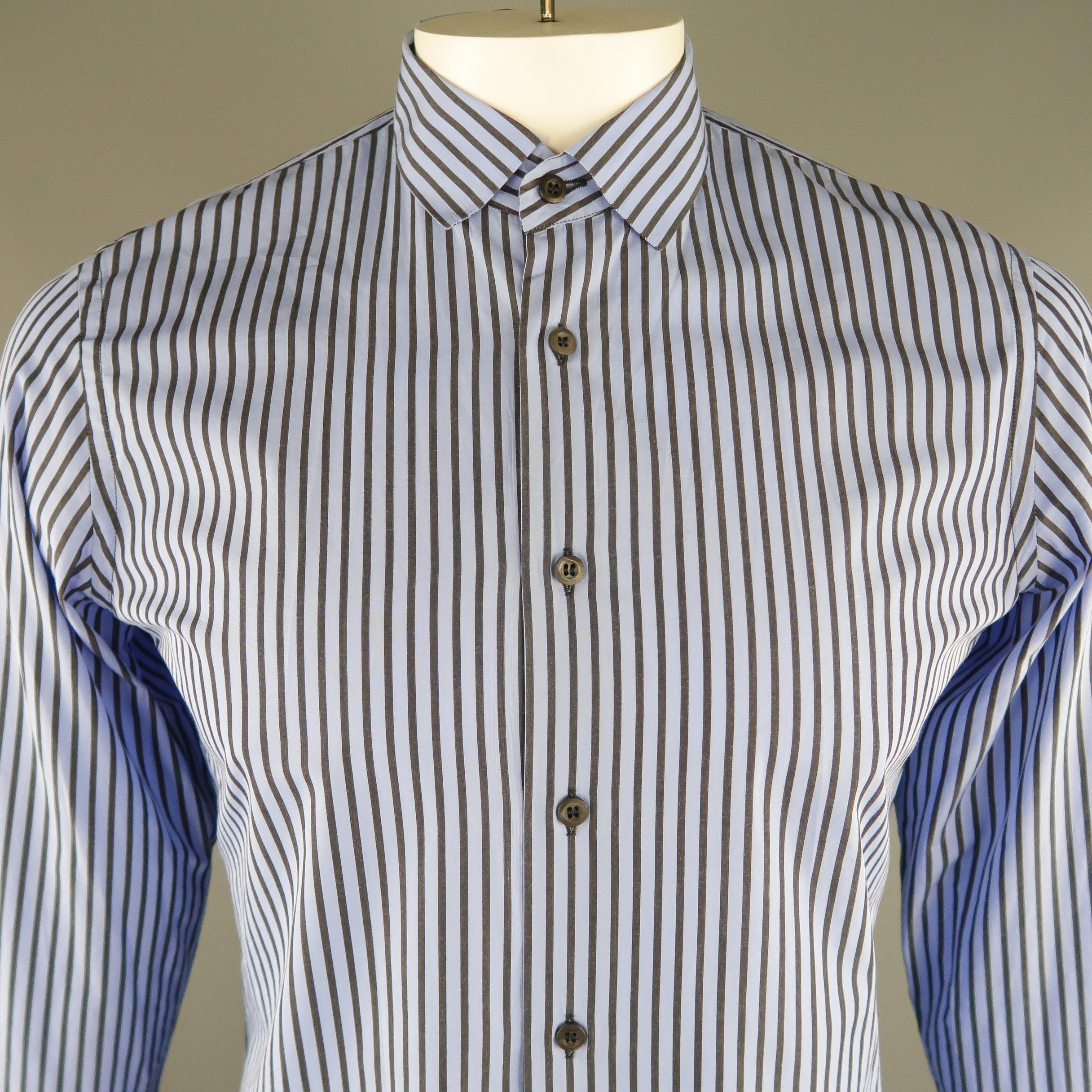 PRADA long sleeve shirt comes in a blue striped cotton material, buttoned cuffs and button up. Made in Italy.   
 
Excellent Pre-Owned Condition.
Marked: 40 IT
 
Measurements:
 
Shoulder: 16 in.  
Chest: 43 in.
Sleeve: 26.5 in.
Length: 29 in.