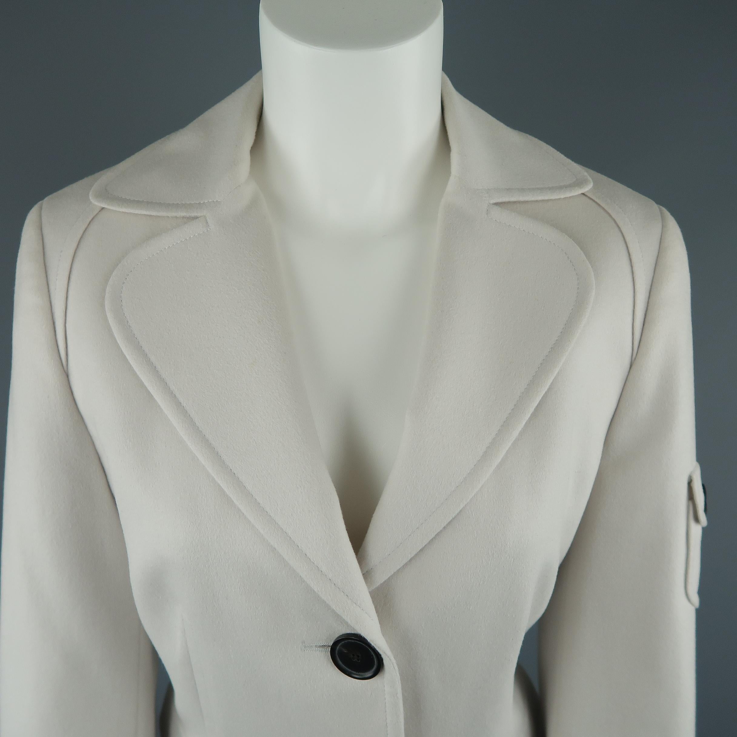 AKRIS cropped blazer comes in off white wool angora blend with a rounded lapel, two button front, and patch flap pockets.  Retails: $1200
 
Excellent Pre-Owned Condition.
Marked: 10
 
Measurements:
 
Shoulder: 15.5 in.
Bust: 40 in.
Sleeve: 24.5