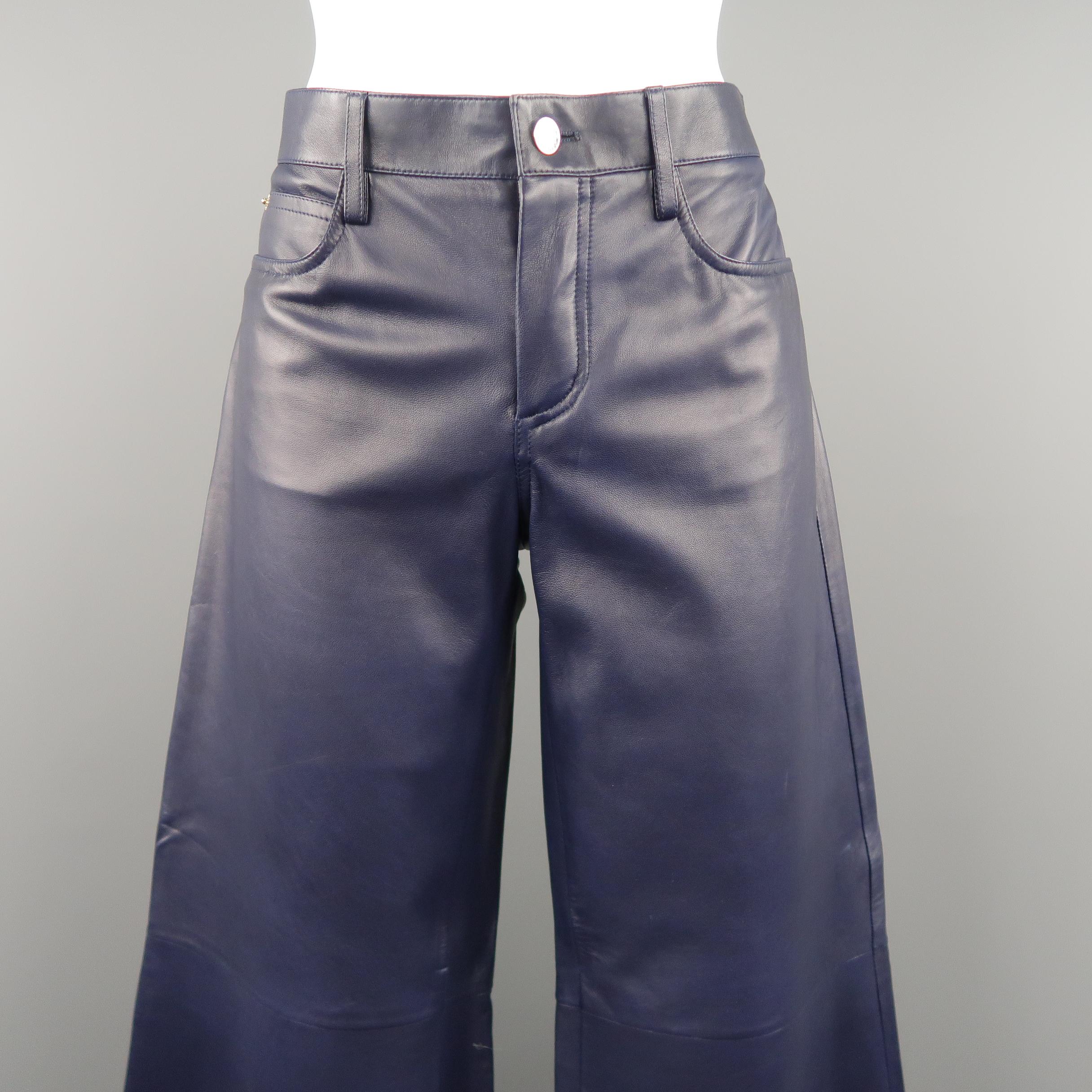 RALPH LAUREN COLLECTION pants come in smooth, supple navy blue lambskin leather with a classic five pocket denim style and wide bell bottom legs. Made in Italy.  Retails - $2450
 
Excellent Pre-Owned Condition.
Marked:
 
Measurements:
 
Waist: 31