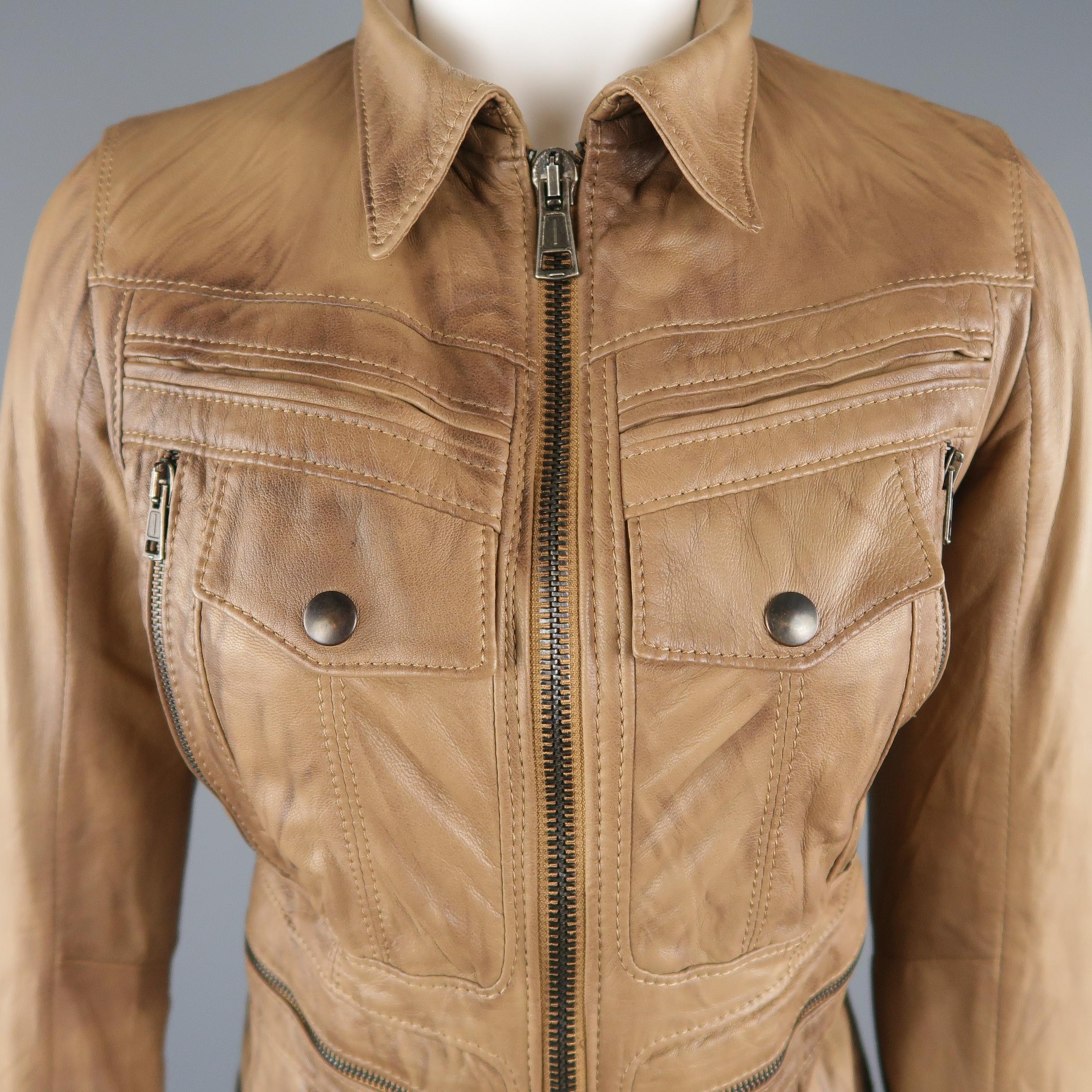 S.W.O.R.D. jacket comes in tan distressed effect leather with a pointed collar, double zip front, snap cuffs, and zip pockets. Made in Italy.
 
Excellent Pre-Owned Condition.
Marked: XS
 
Measurements:
 
Shoulder: 13 in.
Bust: 34 in.
Sleeve: 23