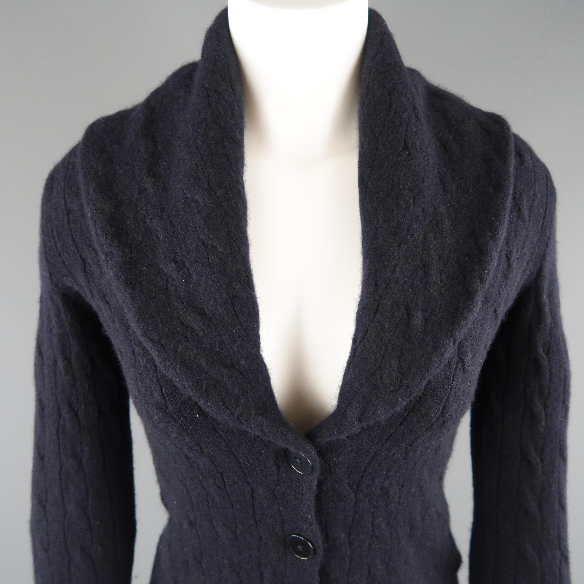 RALPH LAUREN BLACK LABEL cardigan comes in navy cashmere blend cable knit with a wide shawl collar, cropped hem, and four button front.
 
Excellent Pre-Owned Condition.
Marked: S
 
Measurements:
 
Shoulder: 16 in.
Bust: 38 in.
Sleeve: 23.5
