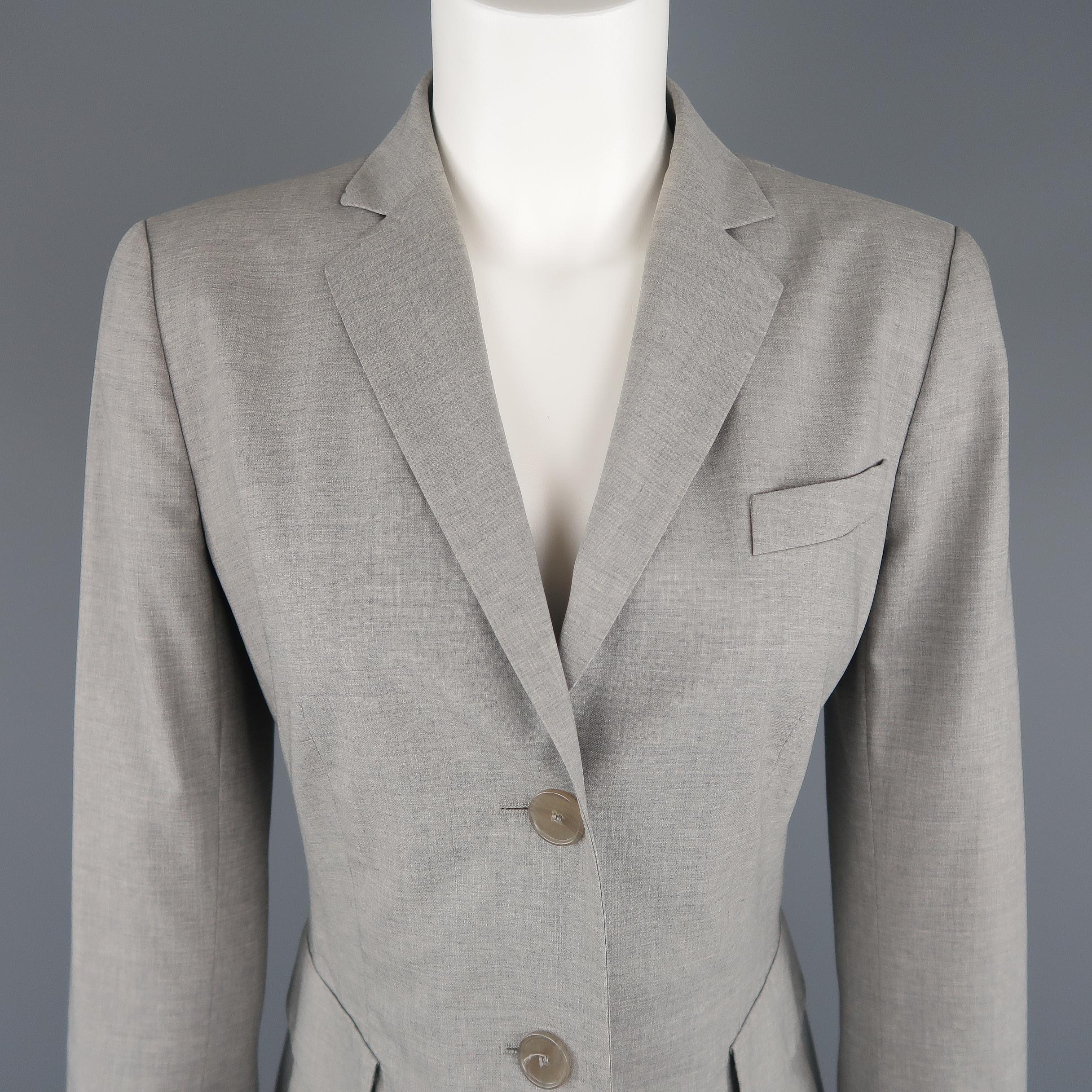 AKRIS long sport coat comes in light weight heather gray acetate blend fabric with a notch lapel, single breasted three button closure, flap pockets, and slit cuffs. Made in Switzerland.
 
Excellent Pre-Owned Condition.
Marked: 6
 
Measurements:
