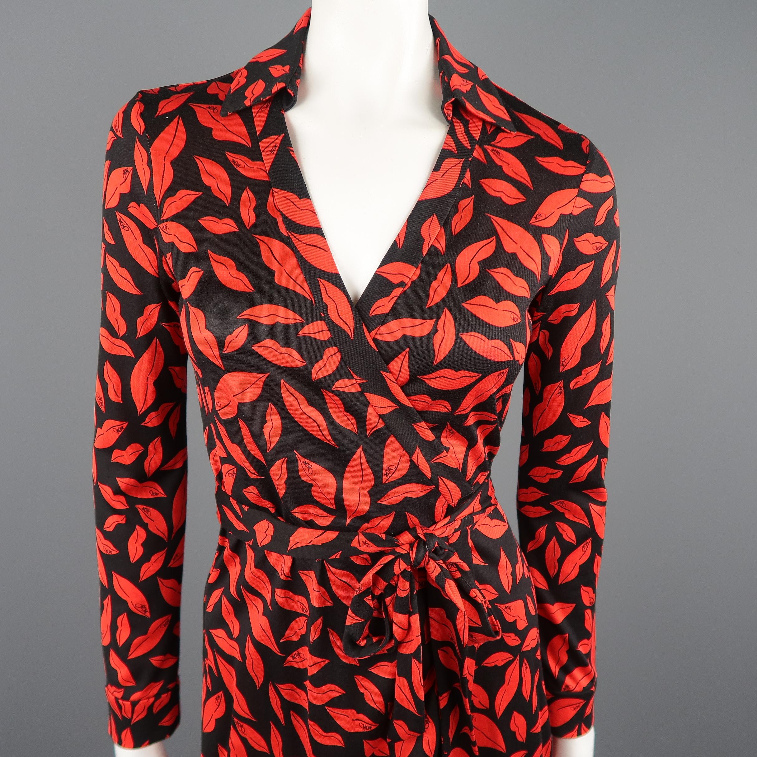 DIAN VON FURSTENBERG wrap dress comes in black silk jersey with all over red lips print and features a deep V neck with collar, adjustable wrap tie closure, and three quarter cuffed sleeves.
 
Very Good Pre-Owned Condition.
Marked: 6
