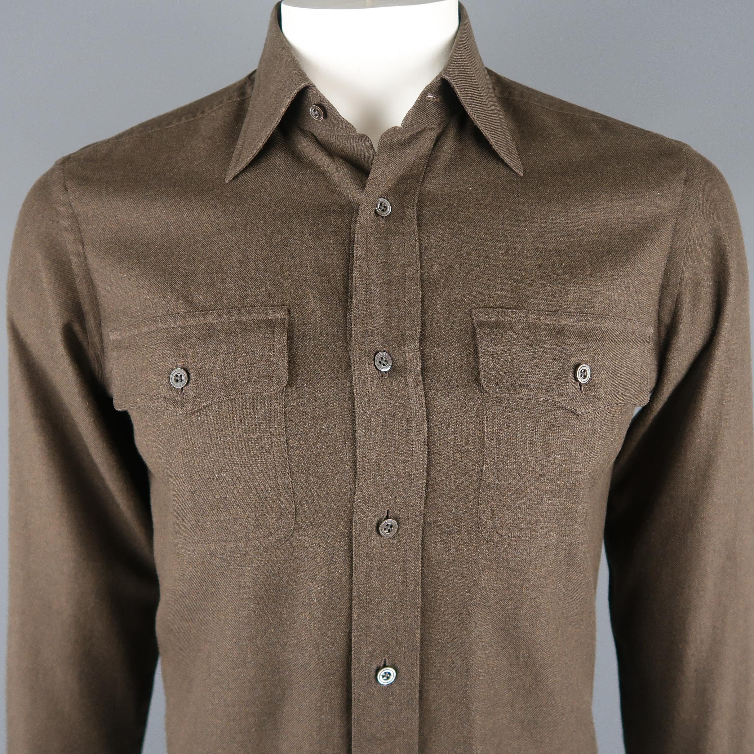TOM FORD long sleeve shirt come in brown solid cotton fabric, button up and with  front patch pockets. Made in Switzerland.
 
Excellent Pre-Owned Condition.
Marked: 39
 
Measurements:
 
Shoulder: 17 in.
Chest: 42  in.
Sleeve: 27.5  in.
Length: 29.5 