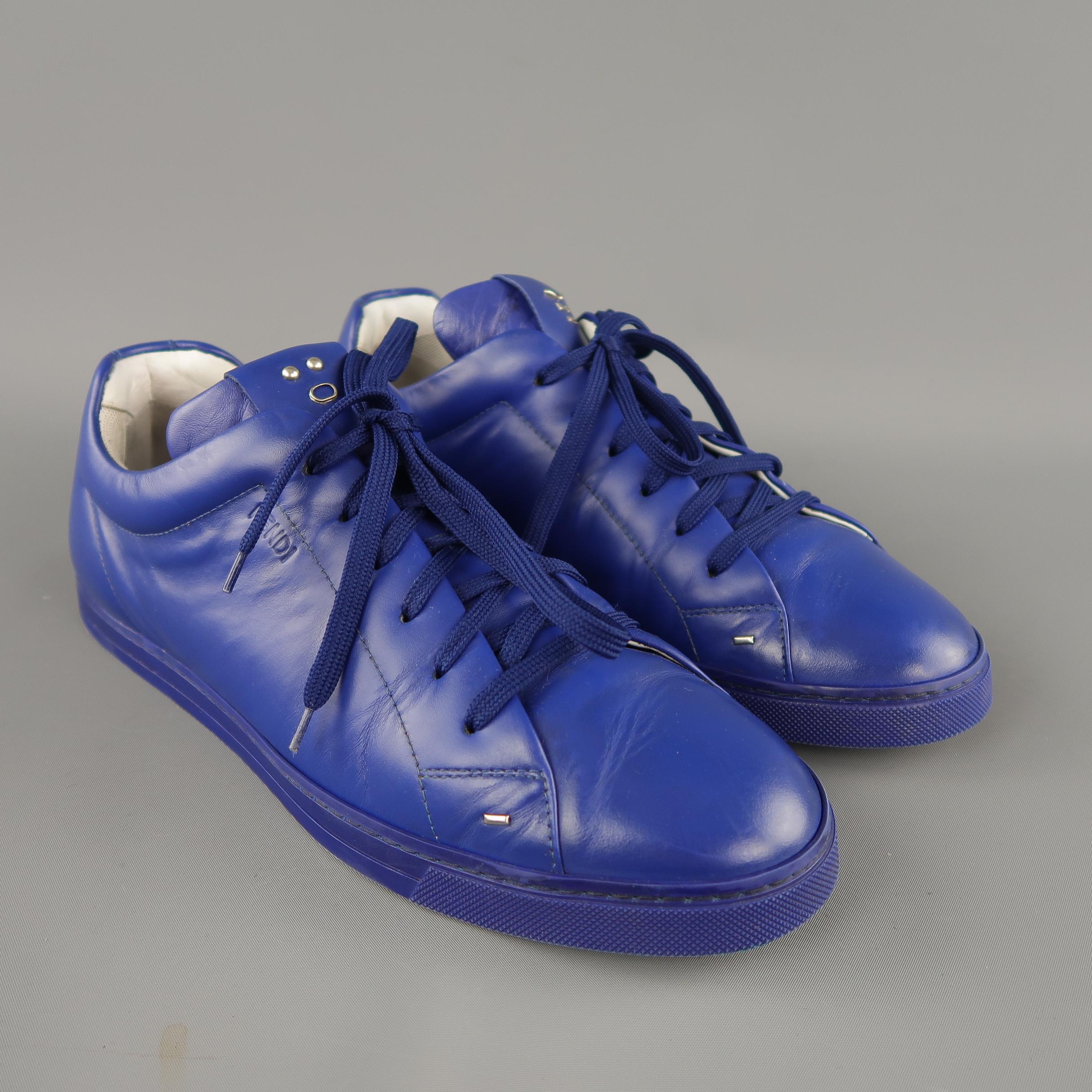 FENDI low top sneakers come in royal blue leather with silver tone metal face detailed tongues. Made in Italy.
 
Good Pre-Owned Condition.
Marked: UK 9
 
Outsole: 12 x 4 in.