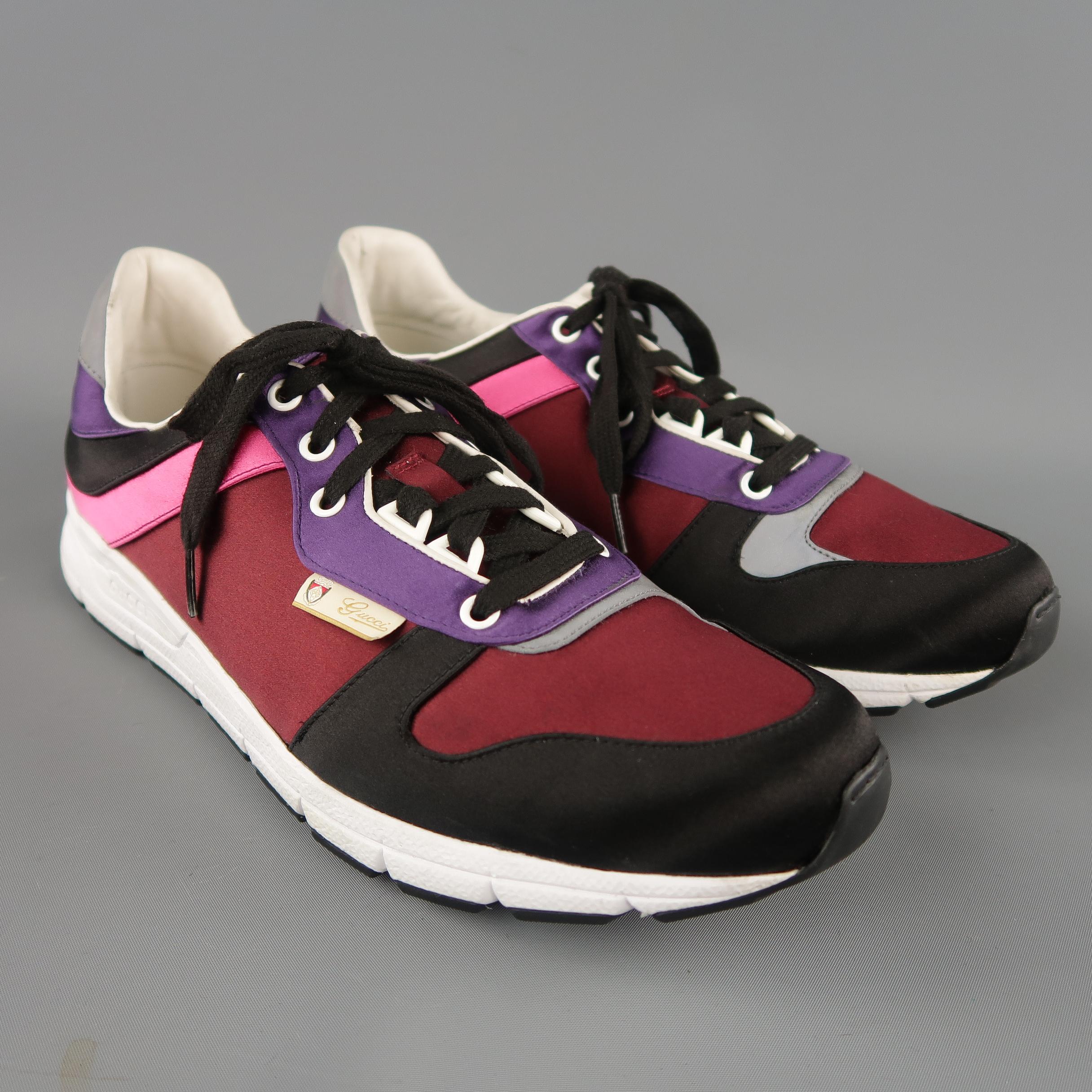 GUCCI Ipanema sneakers come in burgundy  and black satin with a pink and purple striped side, reflective heel panel, and white rubber sole. Made in Italy.
 
Excellent Pre-Owned Condition.
Marked: UK 10
 
Outsole: 12.25 x 4 in.
