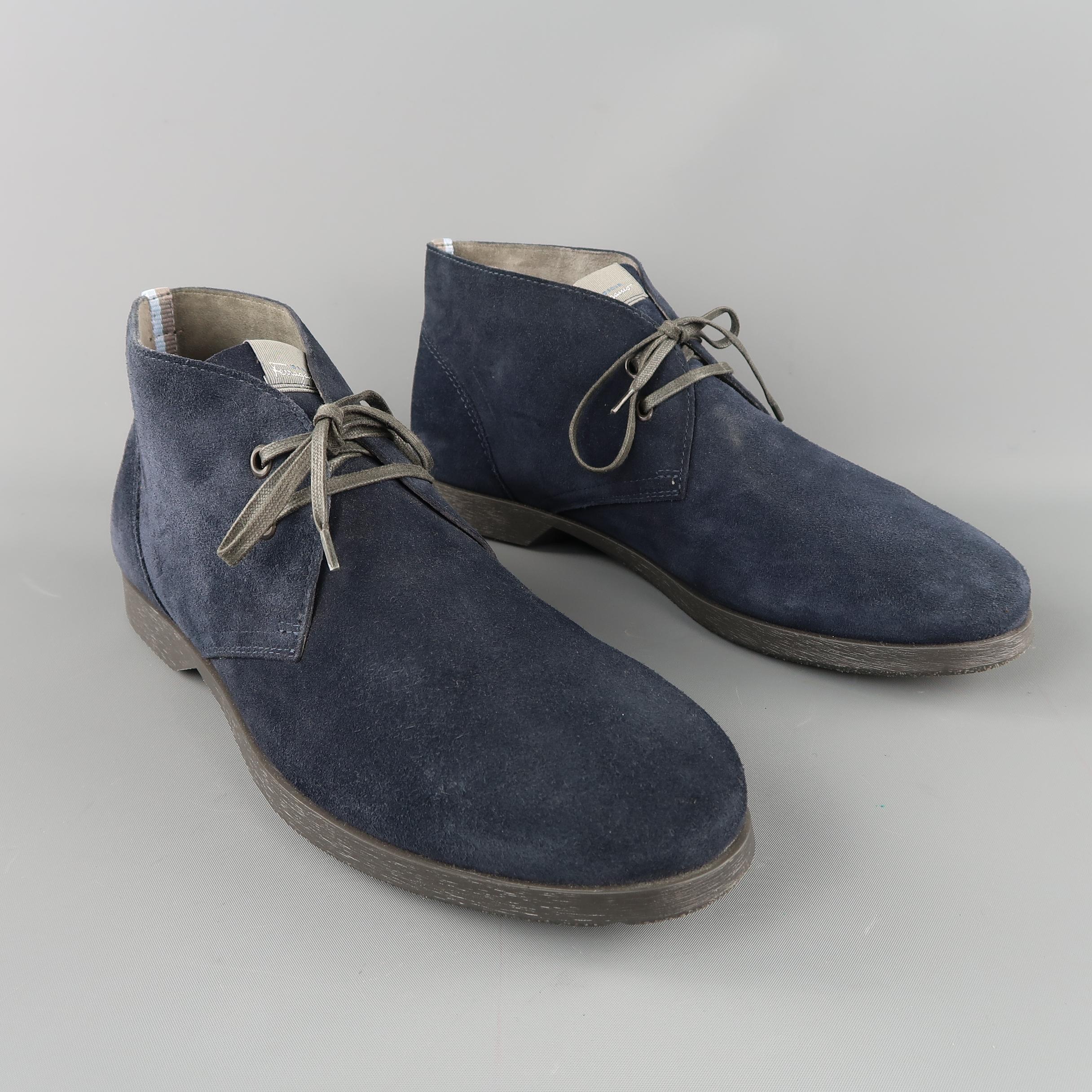SALVATORE FERRAGAMO chukka boots are in navy solid suede, with blue and grey trim detail on the back, rubber sole and  lace up. Made in Italy.
 
Excelent Pre-Owned Condition.
Marked: 10 UK
 
Measurements:
Outsole: 12  x 3  in.