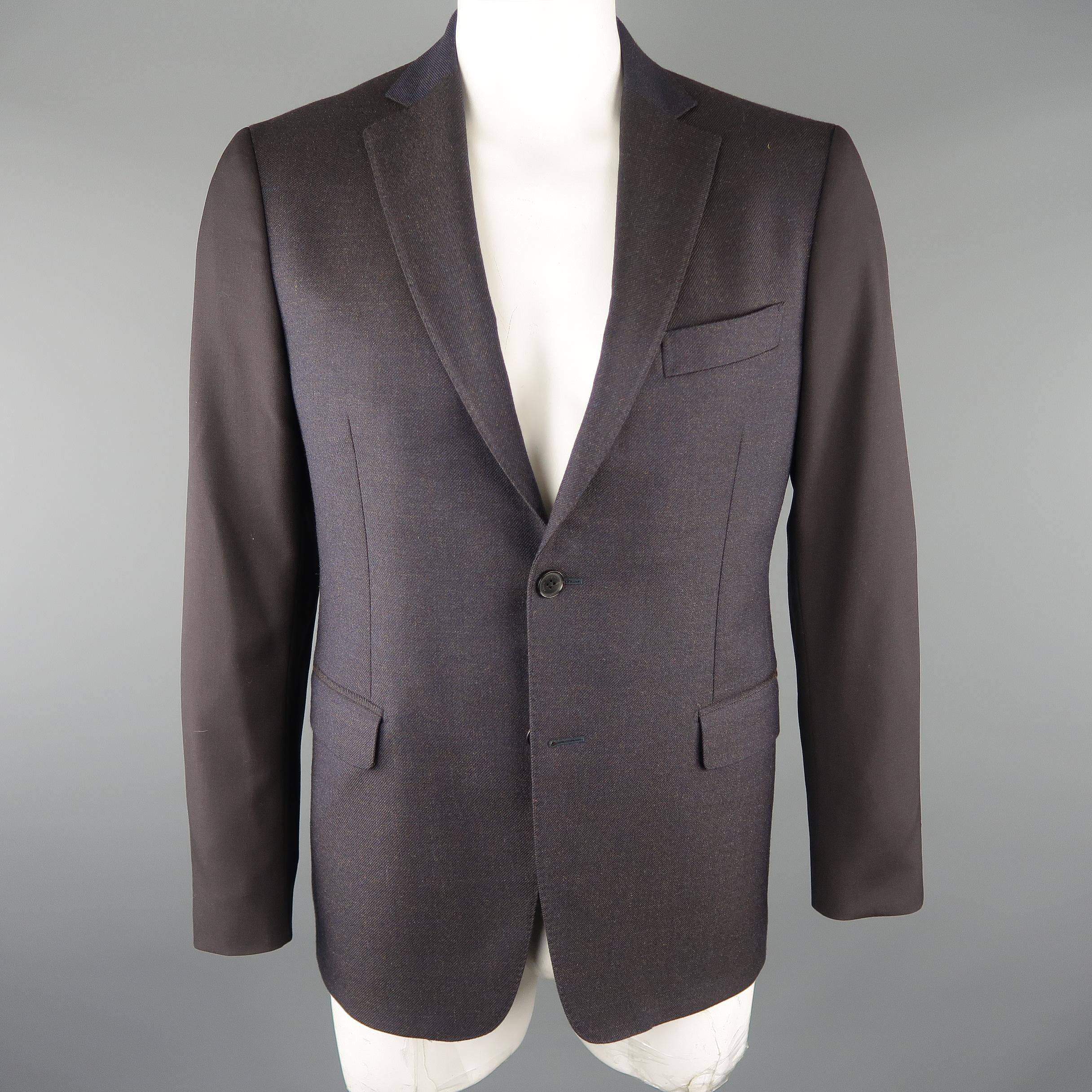 SALVATORE FERRAGAMO sport coat come in navy and black tones, mixed fabrics, in wool and mohair materials, with notch lapel, slit pockets, two buttons closure, single breasted. Made in Italy.
 
Excellent Pre-Owned Condition.
Marked: 52 IT.
