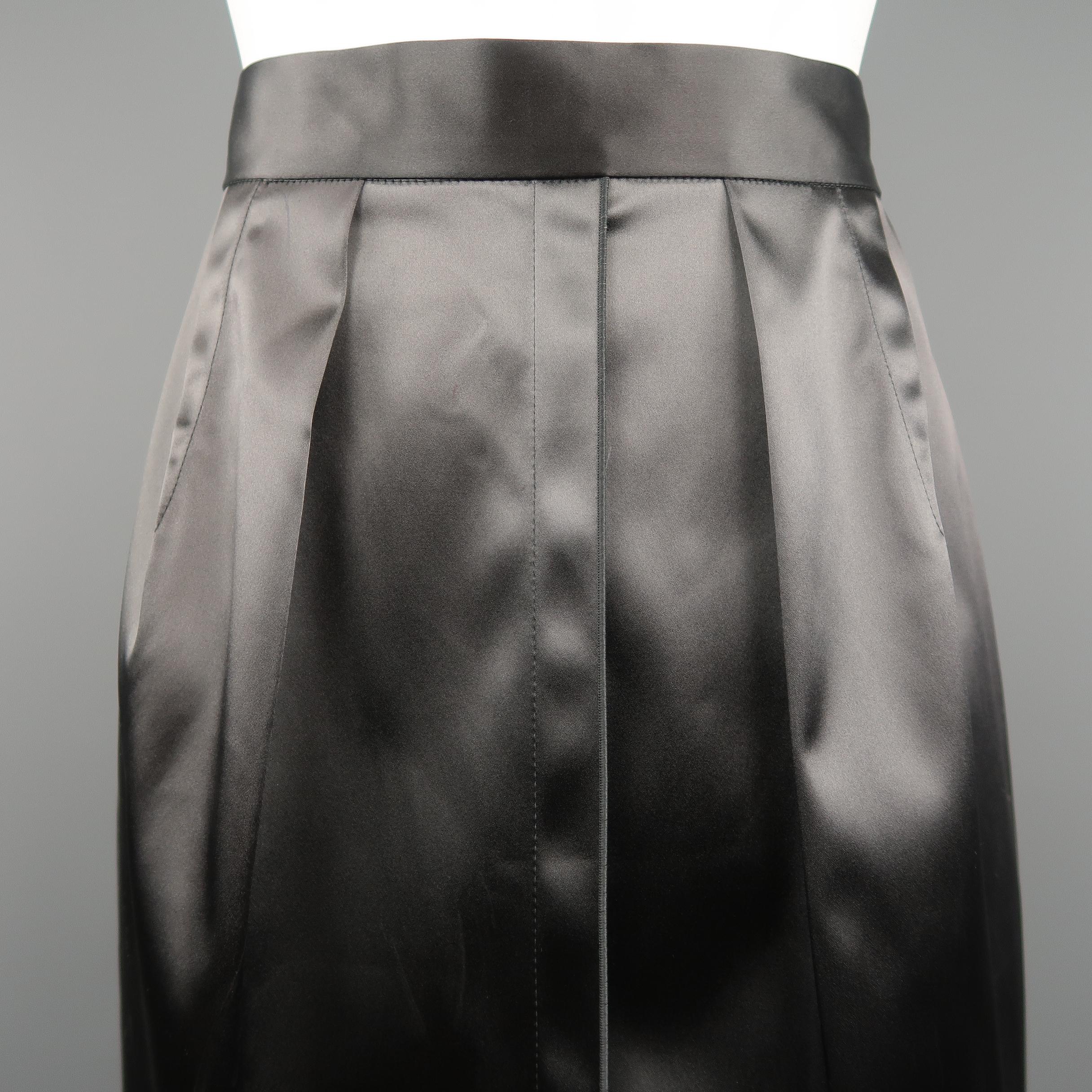 DOLCE & GABBANA pencil skirt come sin stretch satin with a high rise, pleated darts, and back zip. Made in Italy.
 
New with Tags.
Marked: IT 40
 
Measurements:
    Waist: 26 in.
    Hip: 38 in.
    Length: 25 in.