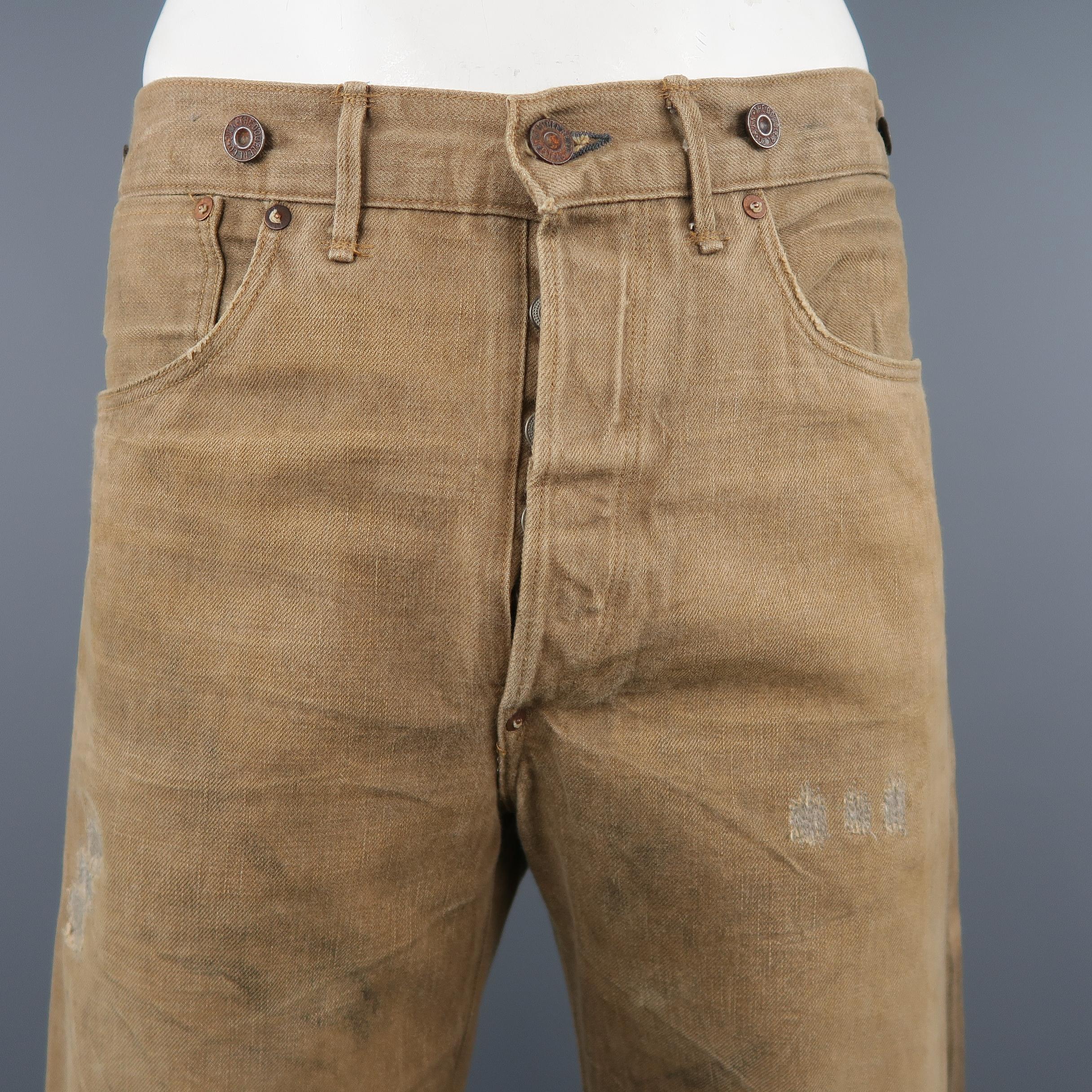 RRL by RALPH LAUREN jeans comes in dirty washed tan beige selvedge denim with all over distressing and embroidery, button fly, back belt, and suspender brace buttons. Made '93. Made in USA. Retail price $490.00.
 
Excellent Pre-Owned