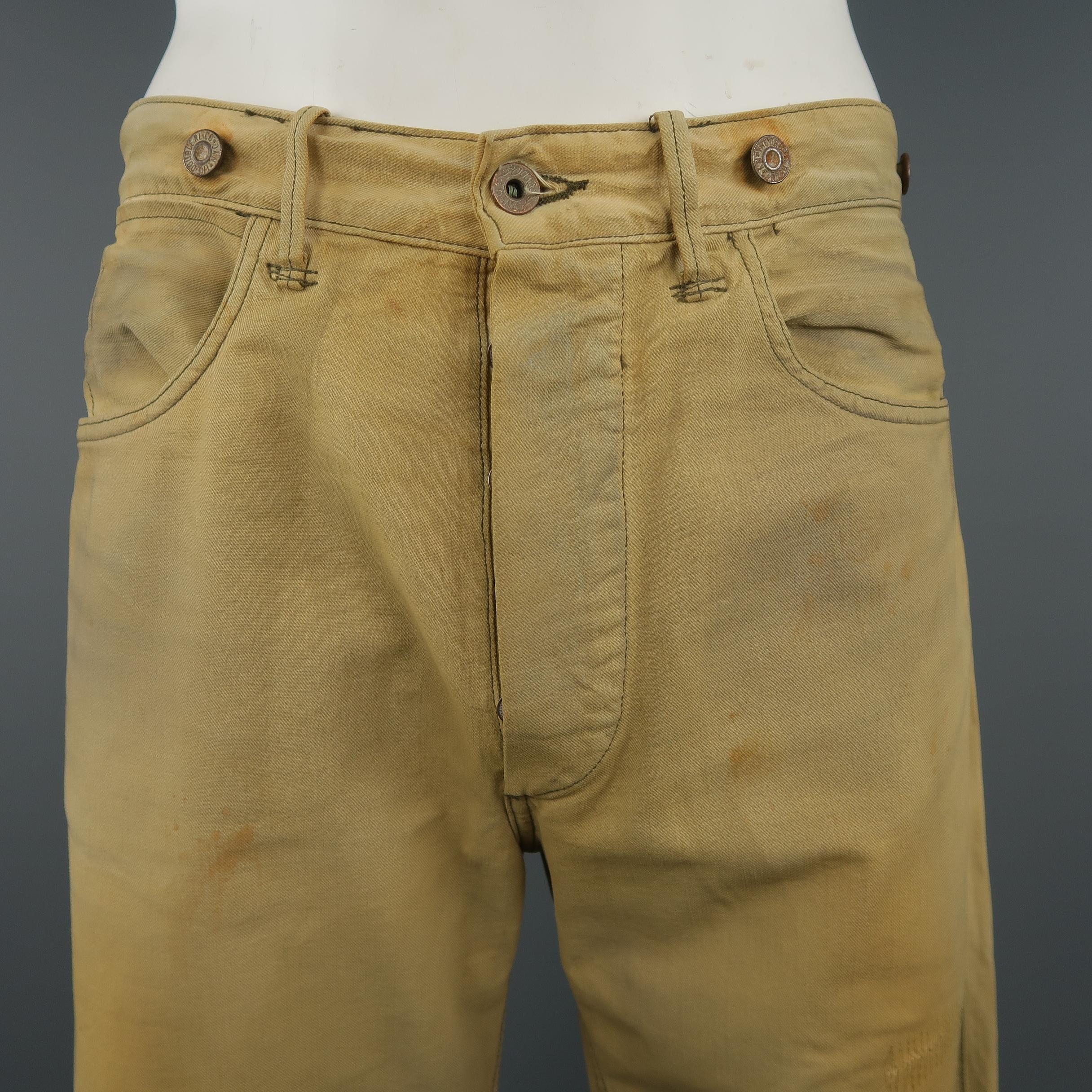 RRL by RALPH LAUREN jeans comes in dirty washed khaki beige denim with all over distressing and embroidery, button fly, back belt, and suspender brace buttons. Made '93. Made in USA. Retail price $490.00
 
Excellent Pre-Owned Condition.
Marked: