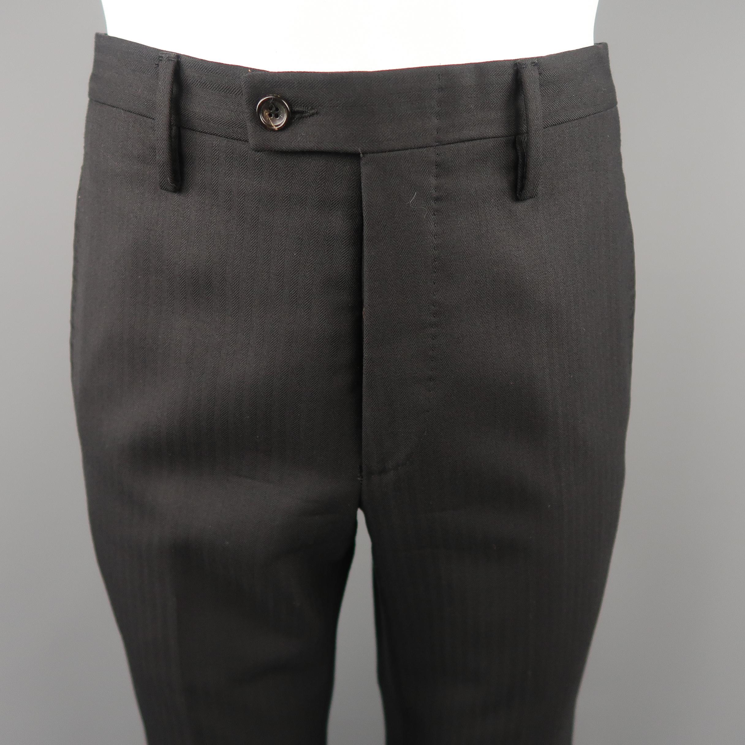 GUCCI flared dress pants come in black tone in herringbone wool material, with seam and slit pockets and button fly. 

Made in Italy. 
Excellent  Pre-Owned Condition.
Marked: 46 R  IT
 
Measurements:
 
Waist:  30  in.
Rise: 10.5  in.
Inseam:  35  in.