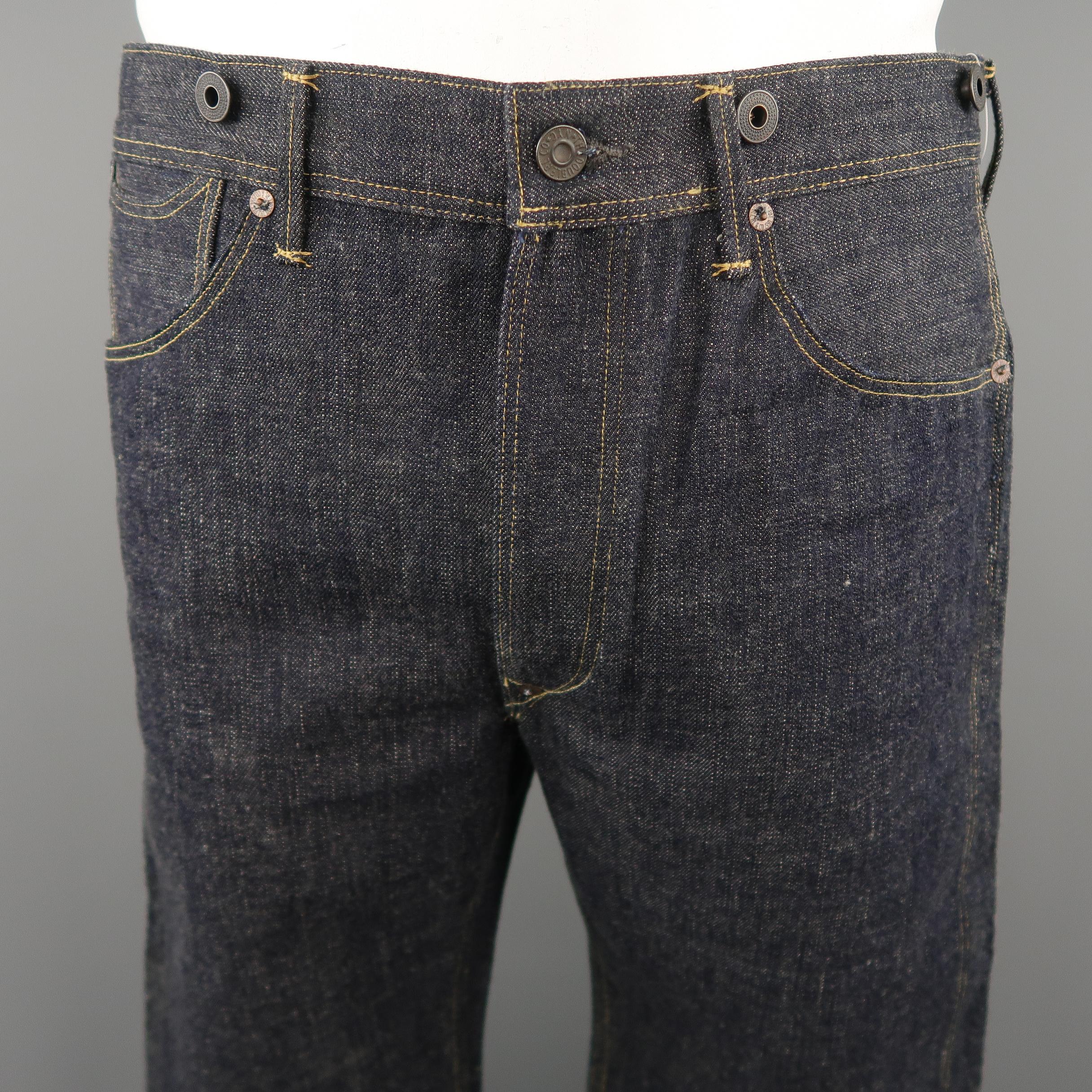 RRL by RALPH LAUREN jeans come in indigo solid denim material, with buttons, button fly and back belt. 

Made in USA.
 
New with Tags.
Marked: 34
 
Measurements:
 
Waist:  34  in.
Rise: 12  in.
Inseam:  34  in.