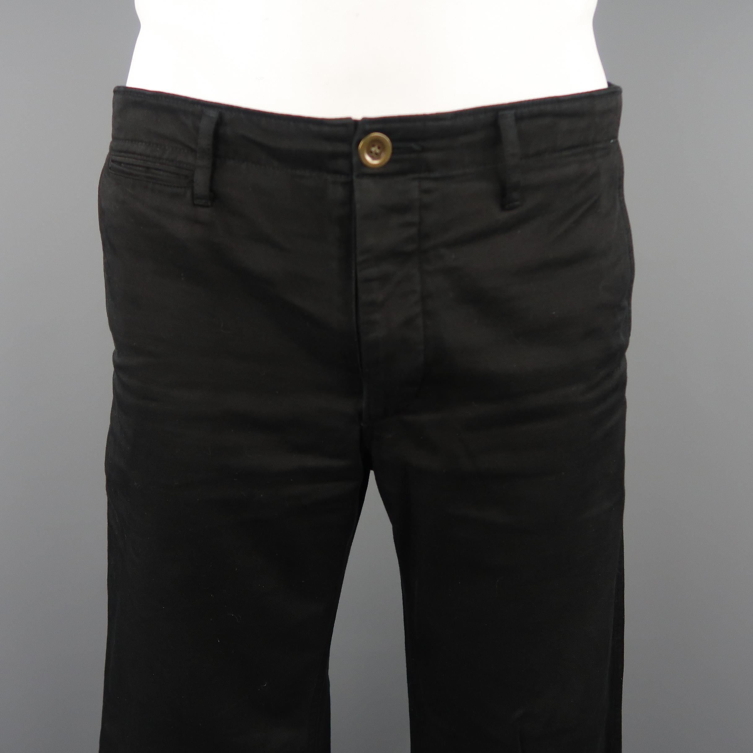 VISVIM slim chino giza casual pants come in black solid cotton material, with button fly, seam and slit pockets and back belt. Featuring light signs of wear throughout. With original package (envelope). 

Made in Japan. 
Good Pre-Owned