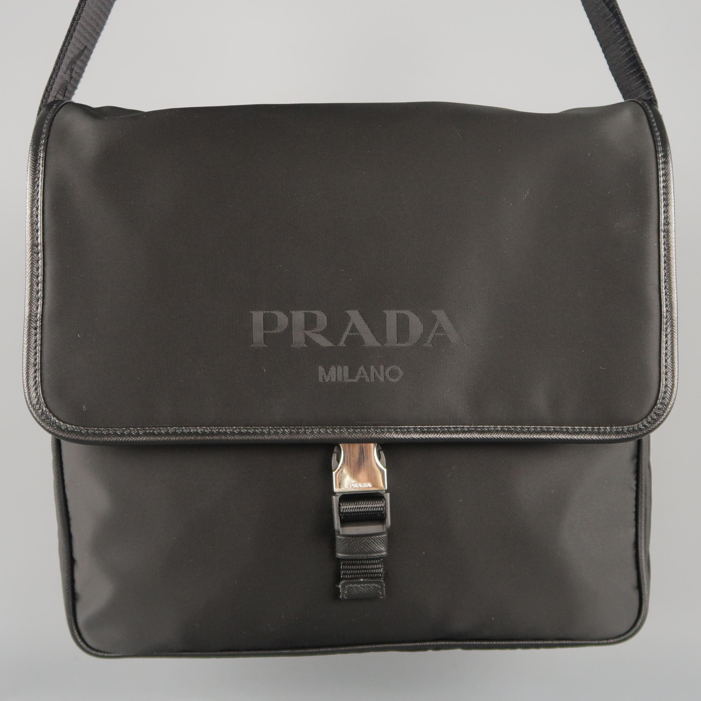 PRADA messenger bag come in black nylon material, with a leather trim, side release buckle closure, two outside pockets - front and back, and nylon shoulder strap with jacquard logo. With authenticity certificate and dust bag.
 
Brand new.
