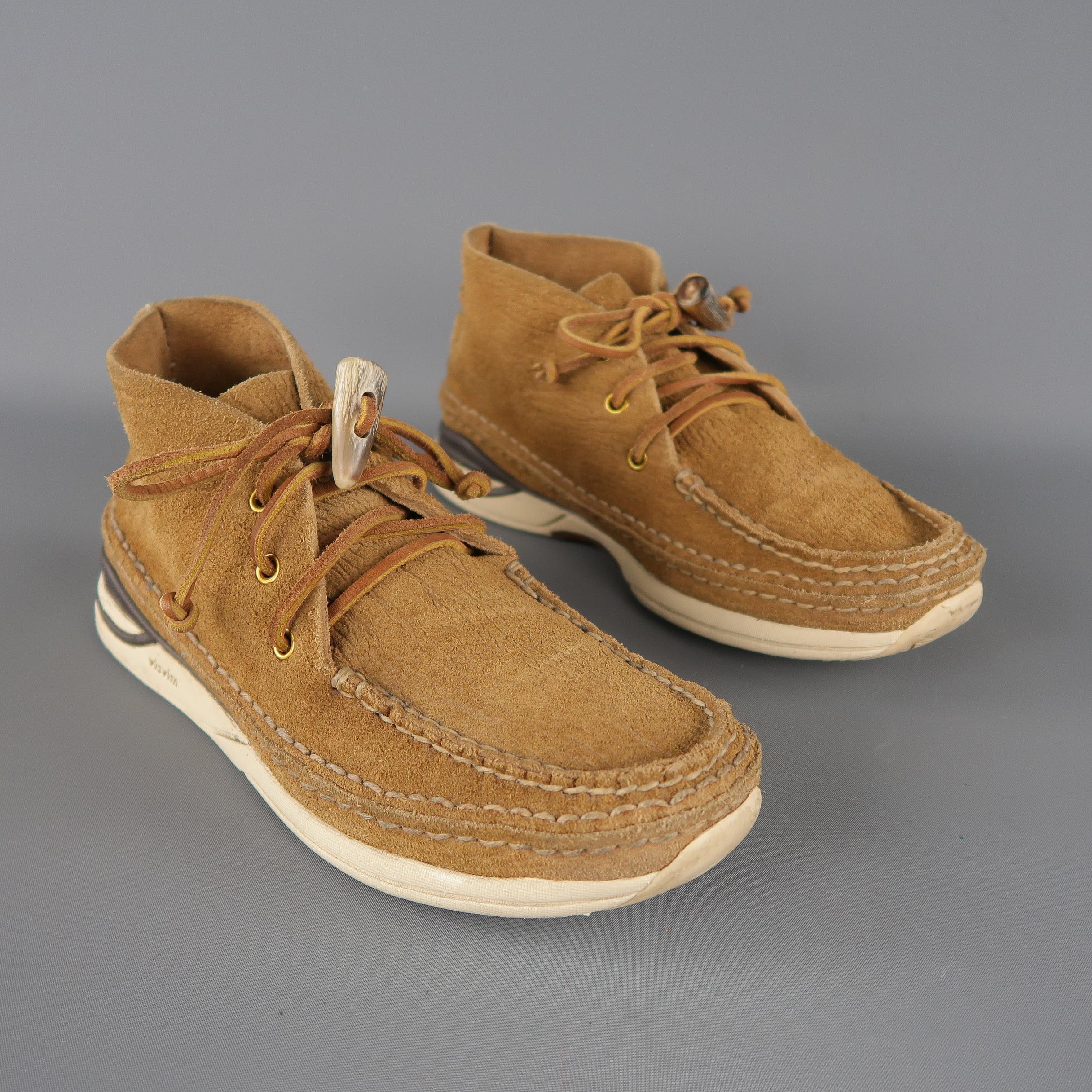 VISVIM casual chukka boots come in tan textured suede, lace up front, contrast detail on the sole and horn toggle on the closure. Minor Wear.
 
Good Pre-Owned Condition.
Marked: 9.5
 
Outsole: 12 x 3  in.