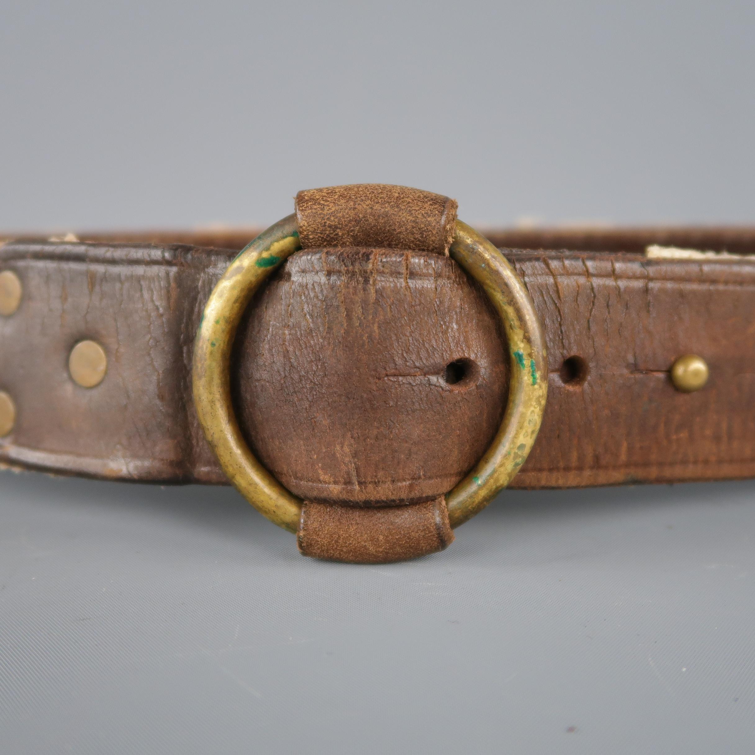 RRL by RALPH LAUREN belt features a dual tone in brown leather and beige rope materials, with a anchor print and an antiqued gold tone aged metal circular buckle . Retail price: 350.00. 
 
Excellent Pre-Owned Condition.
Marked 10/100.
 
Length: 45 