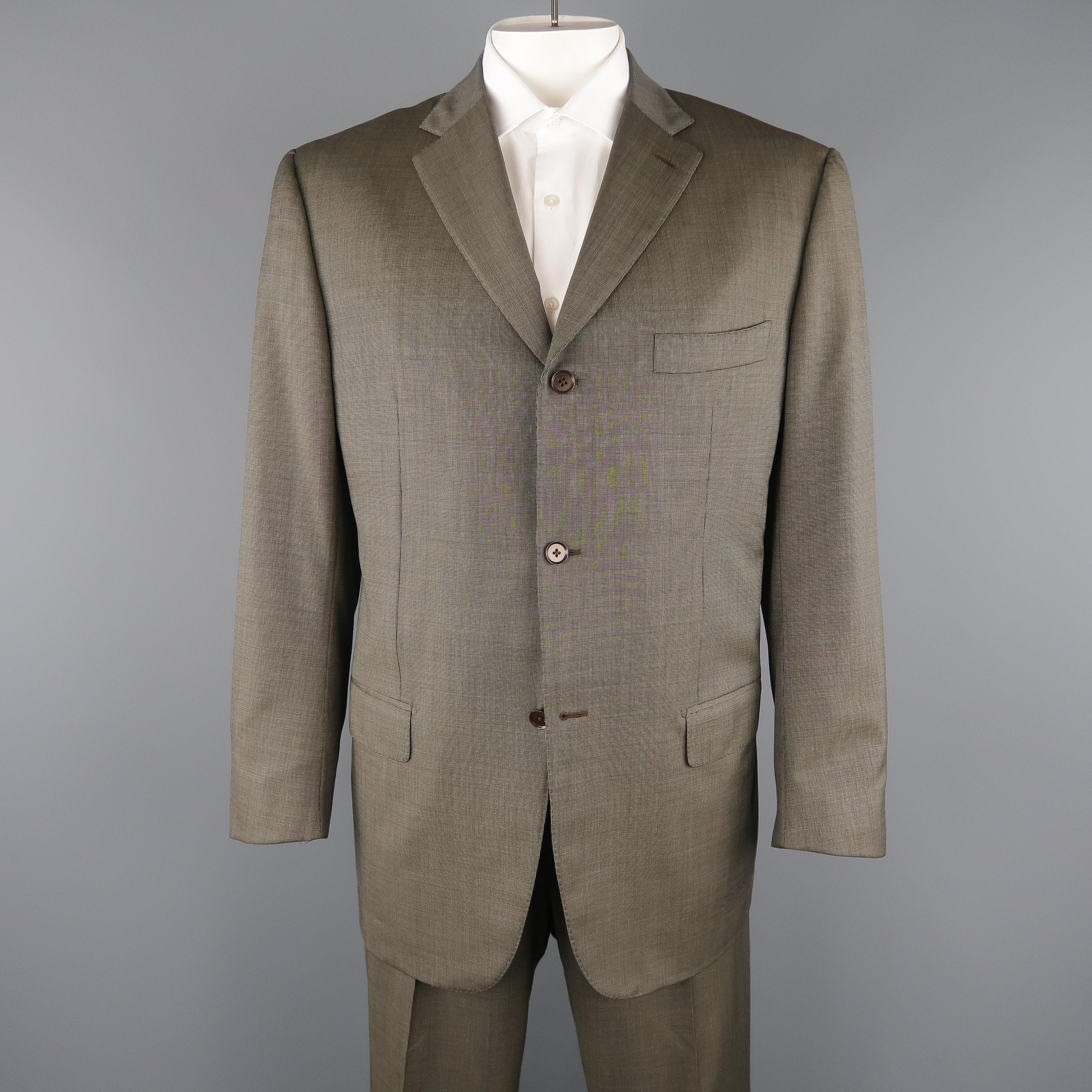 ISAIA two piece suit comes in taupe beige Nailhead pattern wool and includes a single breasted, three button, notch lapel sport coat with functional button cuffs and matching flat front trousers. 

Made in Italy.
 
Excellent Pre-Owned