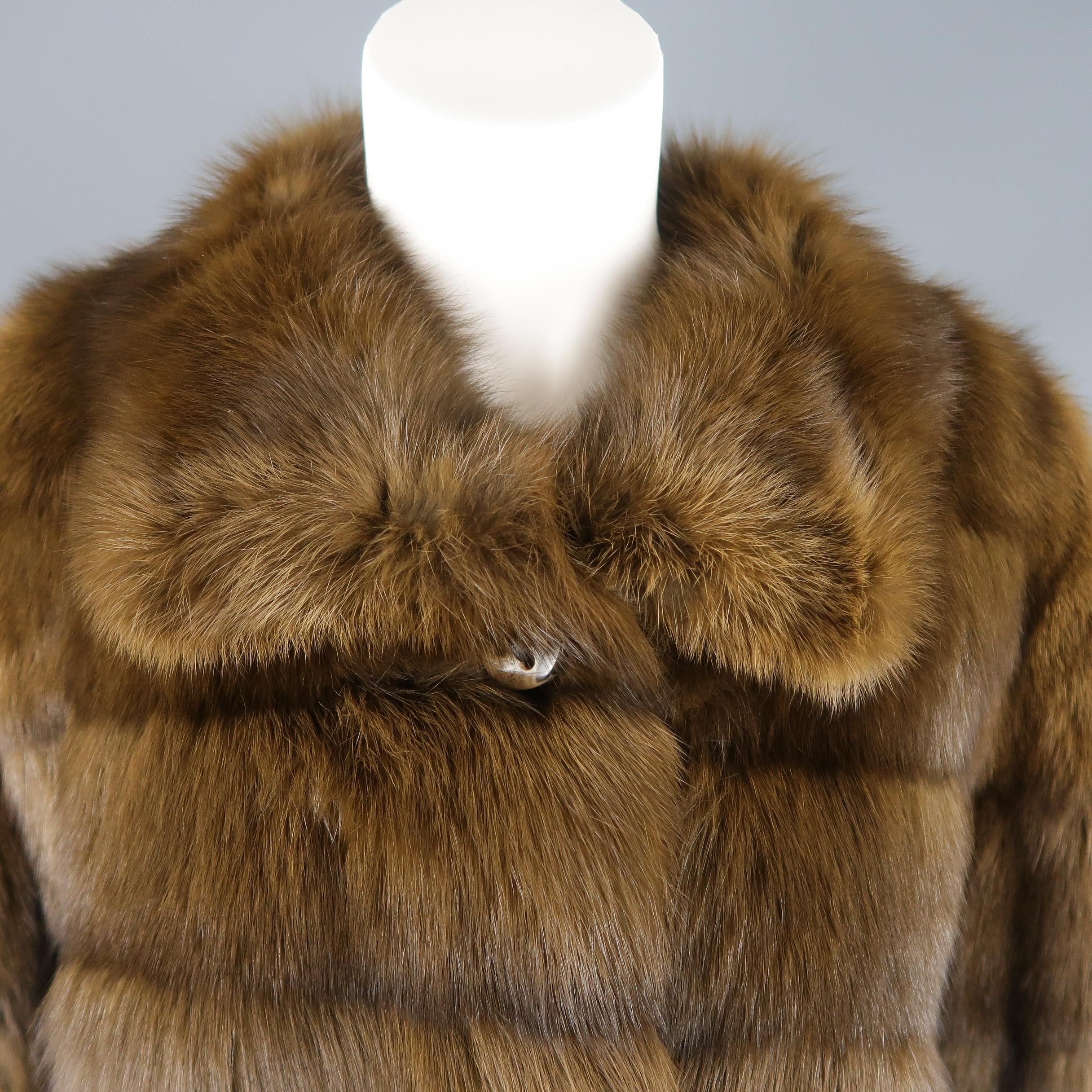 ALTIOLI jacket comes in soft brown sable fur with a collar, three leather tied button closure, slit pockets, and satin liner.
 
Excellent Pre-Owned Condition.
Marked: (no size)
 
Measurements:
Shoulder: 17 in.
Bust: 42 in.
Sleeve: 24 in.
Length: 25