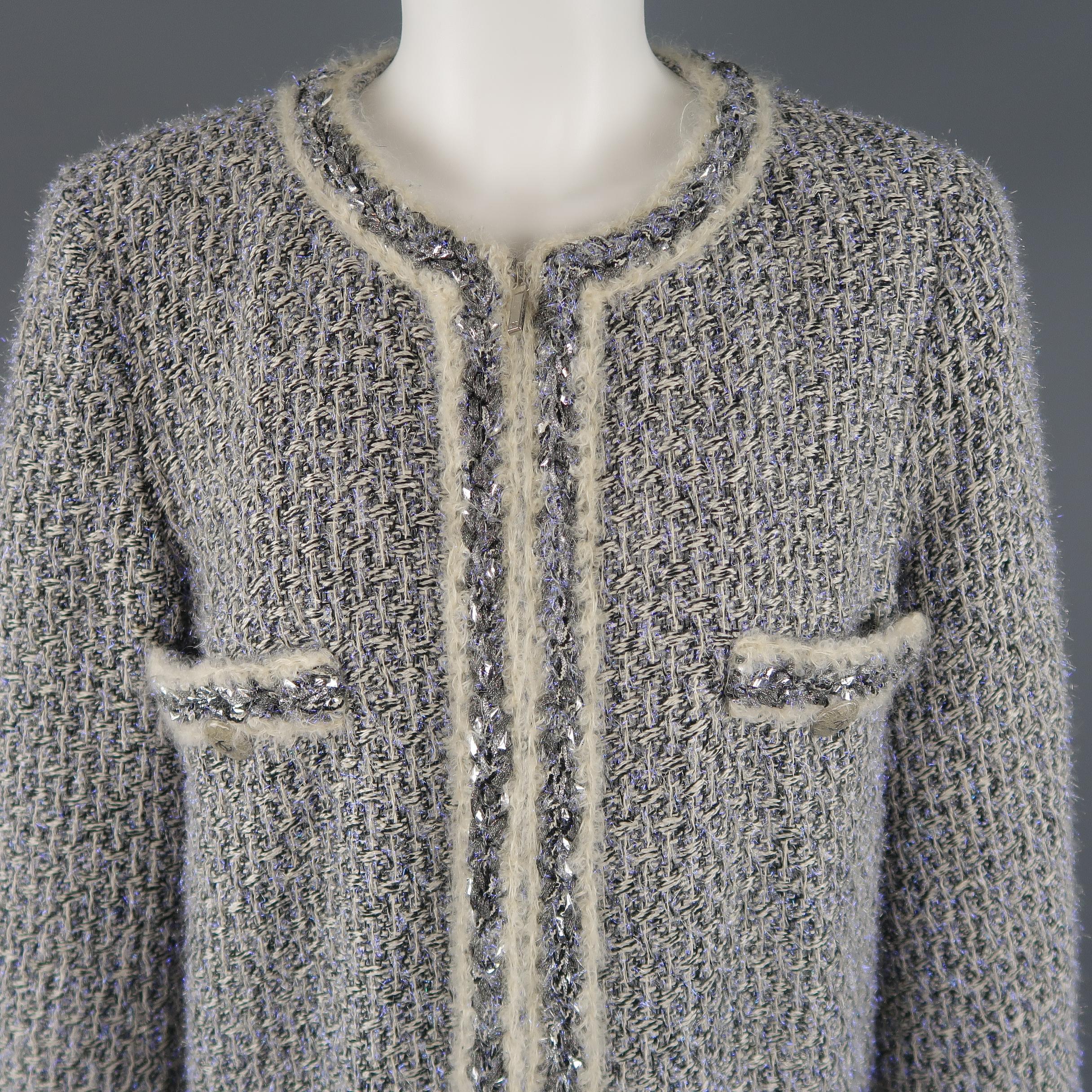 CHANEL Fall 2014 Supermarket Collection coat comes in a cream and black silk blend tweed knit with metallic lavender tinsel sparkles and features a round neck, double zip front, faux pockets with metallic silver crackle enamel CC buttons, and