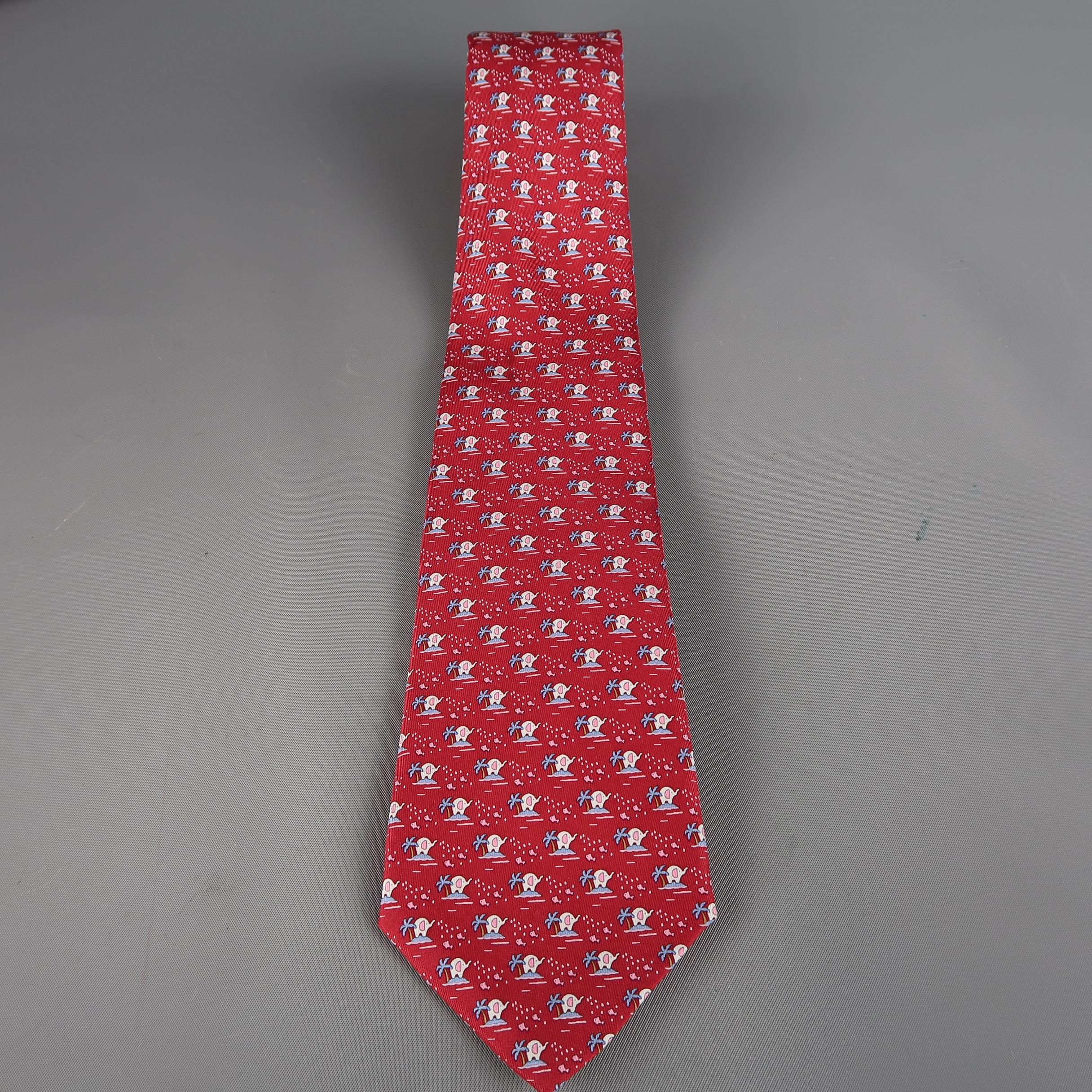 SALVATORE FERRAGAMO  tie come in red silk  with an all over elephant and palm tree print. Made in France.
 
Excellent Pre-Owned Condition.
 
Width: 3.5 in.