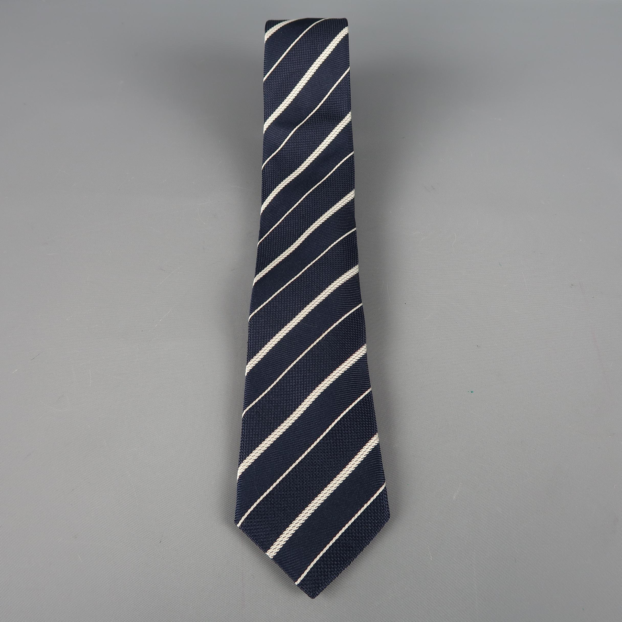 GIORGIO ARMANI tie come in navy silk with all over diagonal silver stripes. Made in Italy.
 
Excellent Pre-Owned Condition.
 
Width: 3 in.