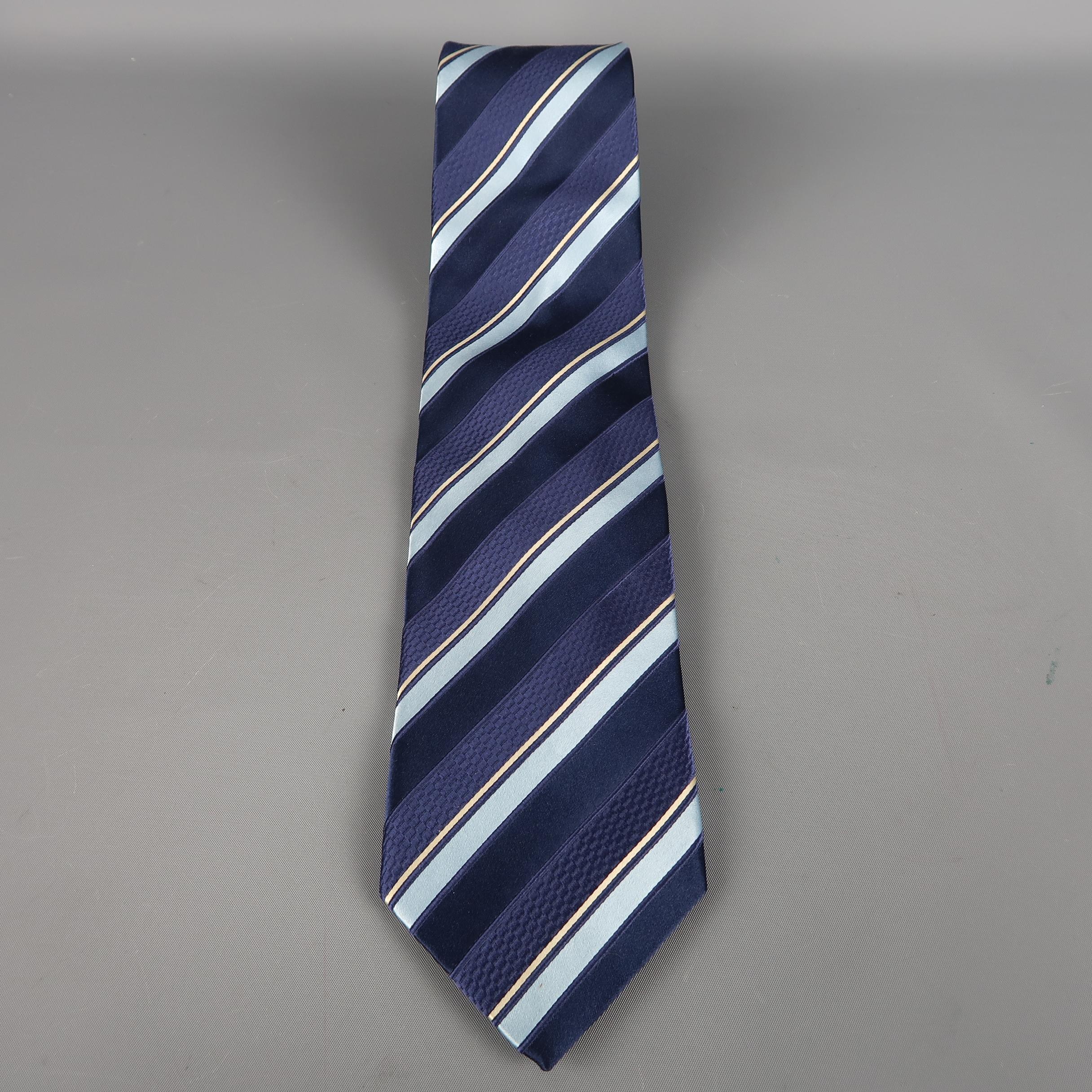ERMENEGILDO ZEGNA tie come in navy silk  with all over blue and silver diagonal stripes. Made in Italy.
 
Excellent Pre-Owned Condition.
 
Width: 3.5 in.
