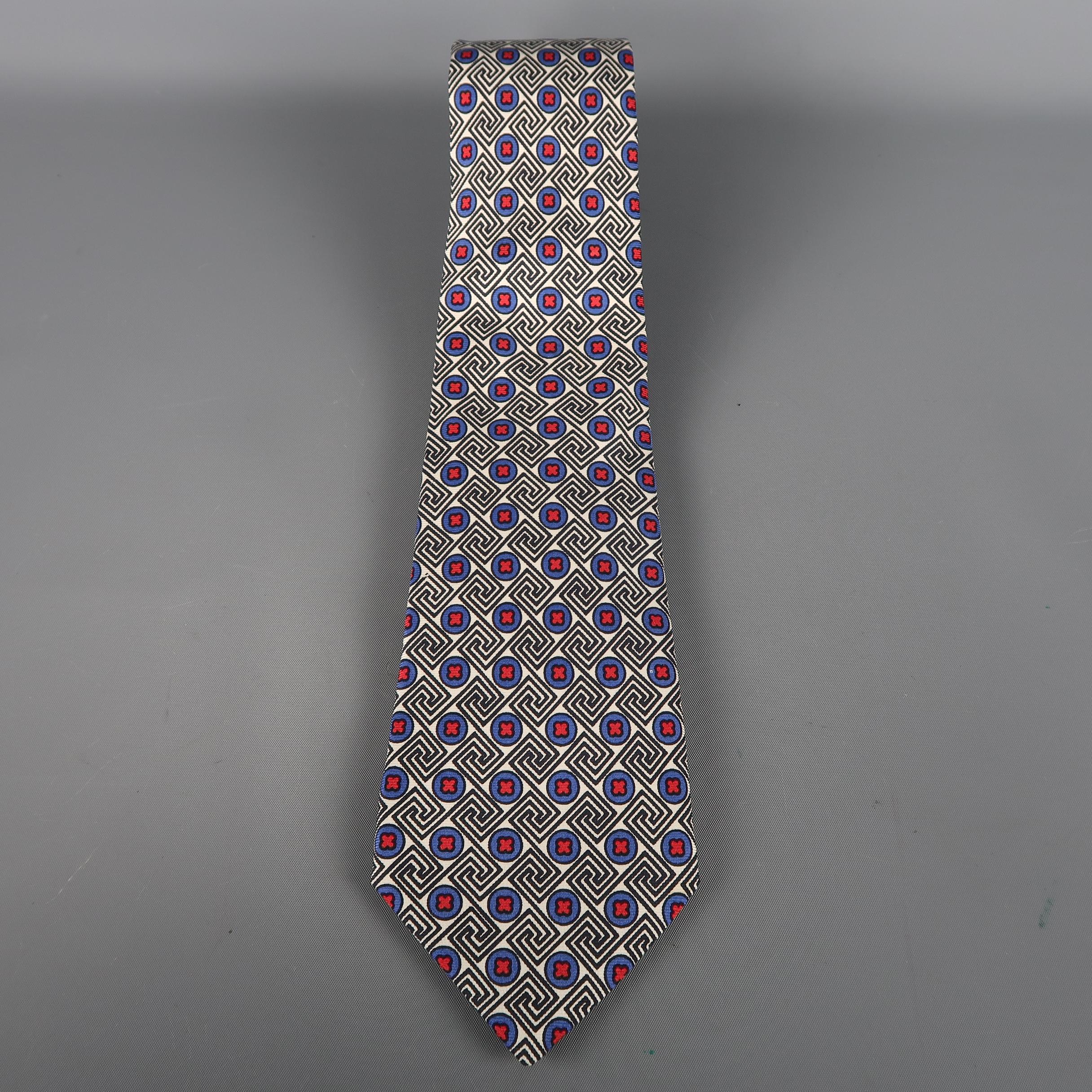 KITON  tie come in white, blue and  black silk  with an all over red crosses print. Made in Italy.
 
Excellent Pre-Owned Condition.
 
Width: 3.5 in.