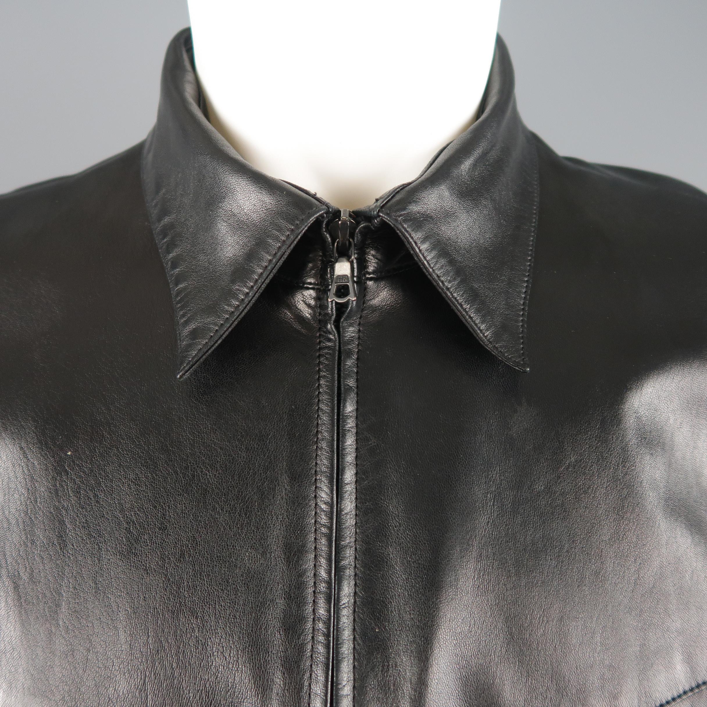 Rare & Vintage CLAUDE MONTANA jacket comes in black leather with a pointed collar, zip up front, slanted pockets, and silver tone studded pattern shoulders. Minor wear. Label faded. 

Made in France. 
Good Vintage Condition.
Marked: IT 50

