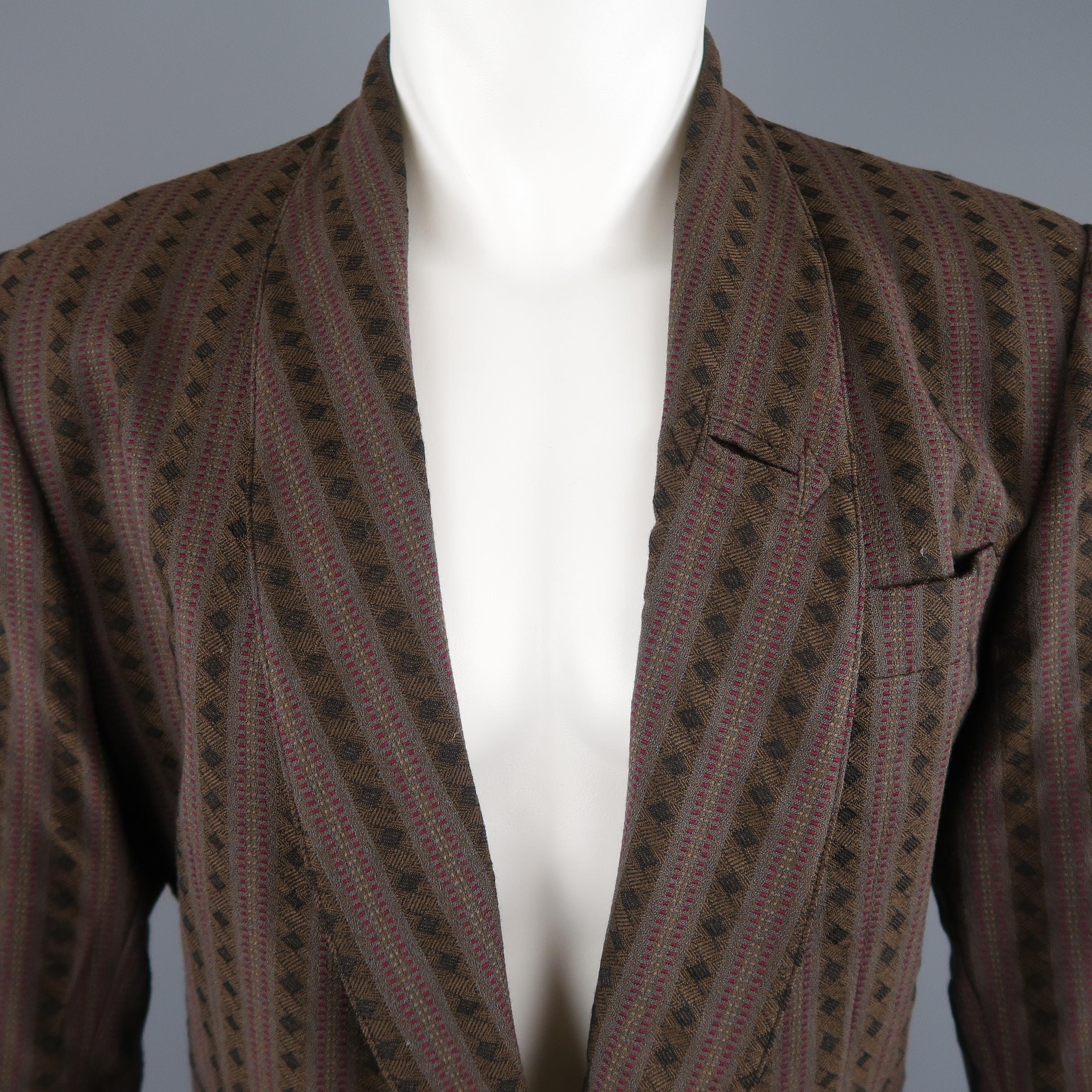 Vintage 1980's JEAN PAUL GAULTIER pour GIBO sport coat comes in brown striped pattern wool with a shawl collar, two button single breasted front, patch and slit pockets, and signature back tab. Circa 1985. 

Made in Italy. 
Excellent Pre-Owned