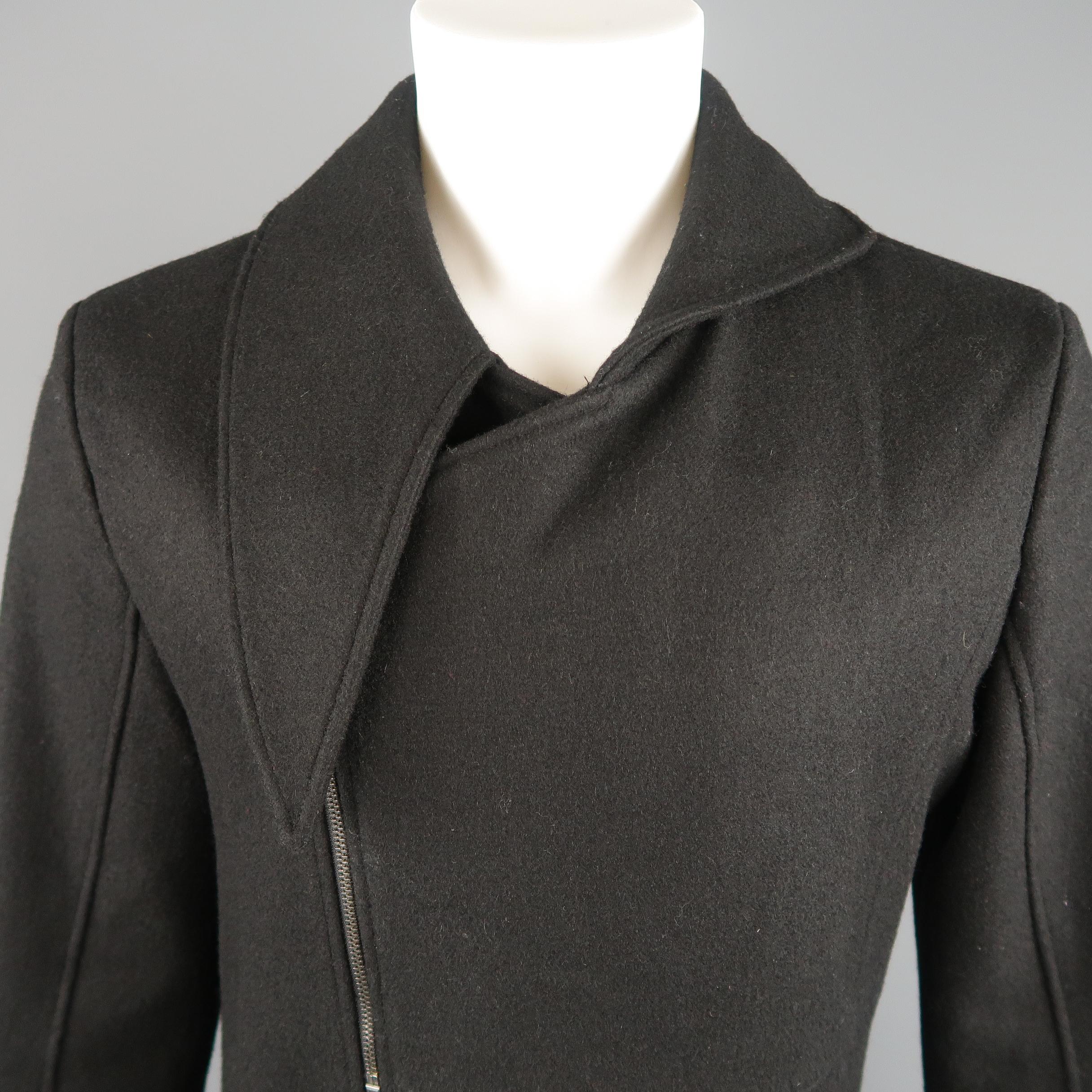 D. GNAK by KANG D. jacket comes in black wool blend with a long asymmetrical pointed half collar, zip and snap double breasted closure, bi level hem sleeves, and asymmetrical seams.
 
Excellent Pre-Owned Condition.
Marked:  IT 50
 
Measurements:
