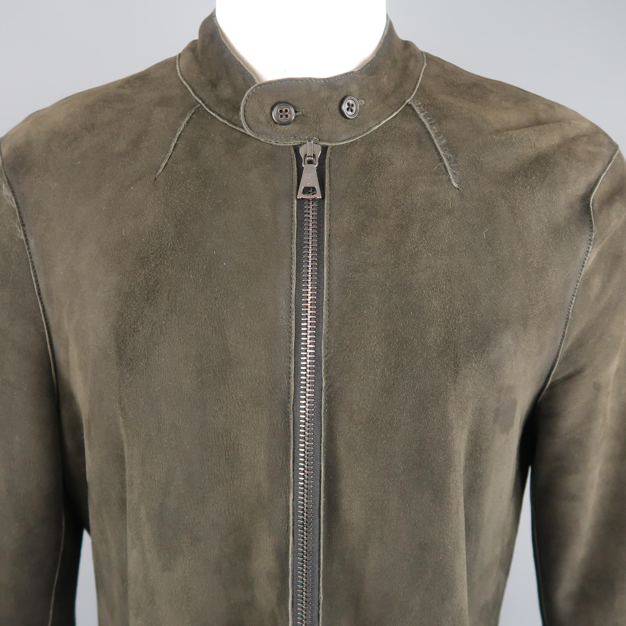 JOHN VARVATOS coat comes in olive green shearling with full fur liner, and features a band collar, zip front, double zip pockets, and zip cuffs. Wear throughout.
 
Good Pre-Owned Condition.
Marked: IT 50
 
Measurements:
 
Shoulder: 19 in.
Chest: 44