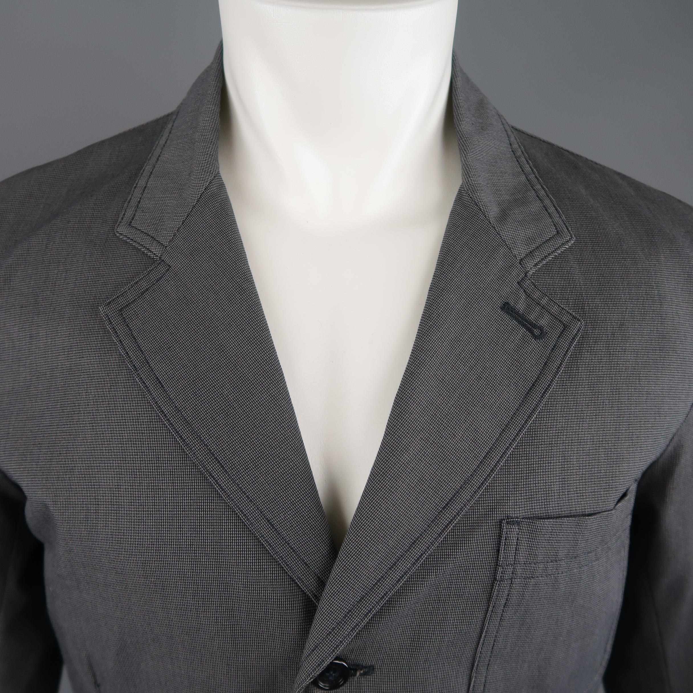 BURBERRY LONDON sport coat comes in gray nail-head cotton with a notch lapel, three button single breasted front, and patch flap pockets. 

Made in Italy. 
Excellent Pre-Owned Condition.
Marked: IT 50 R
 
Measurements:
 
Shoulder: 18 in.
Chest: 40