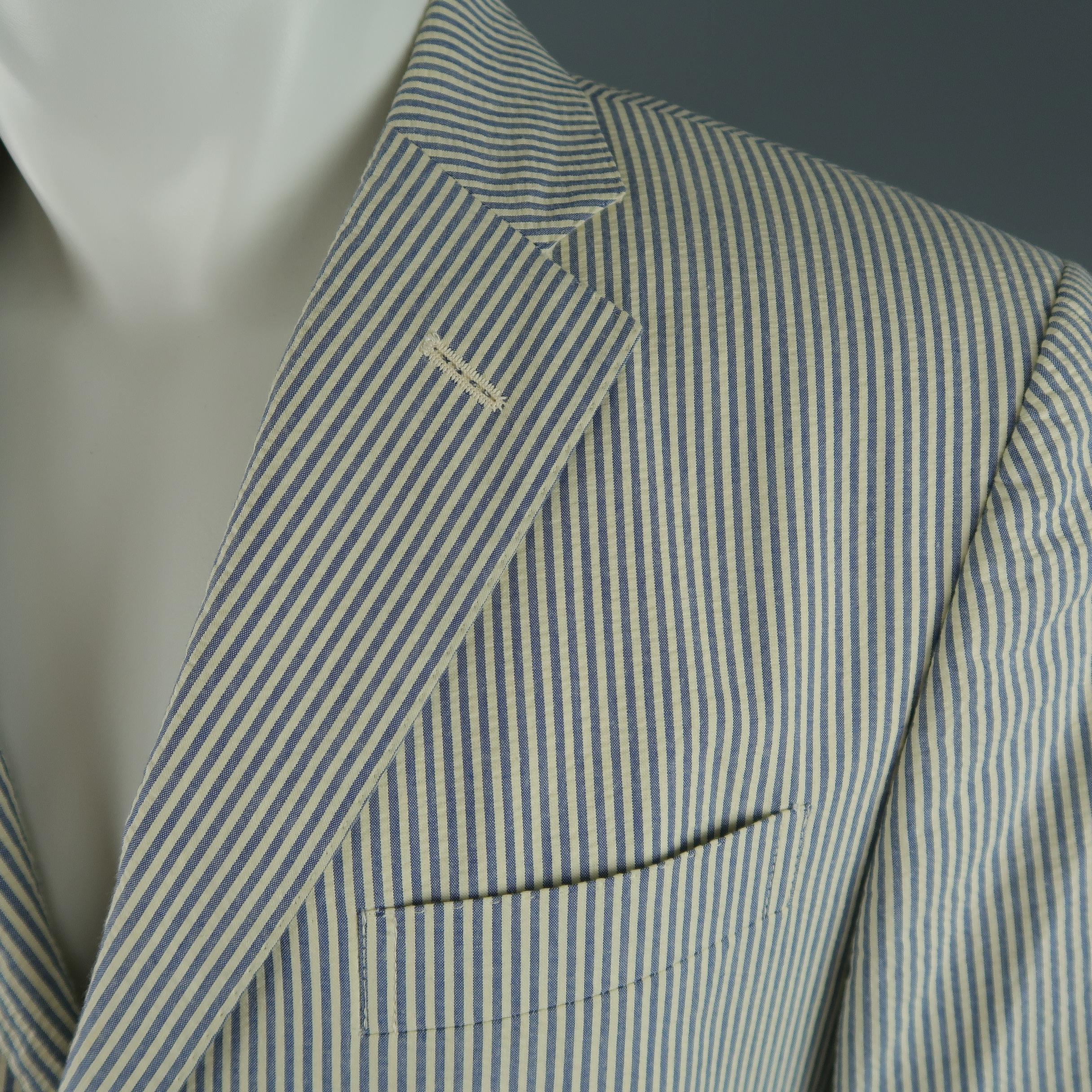 POLO RALPH LAUREN sport coat comes in cream and blue striped seersucker with a notch lapel, three button, single breasted front, and flap pockets. Made in Italy.
 
Excellent Pre-Owned Condition.
Marked: 40
 
Measurements:
 
Shoulder: 18 in.
Chest: