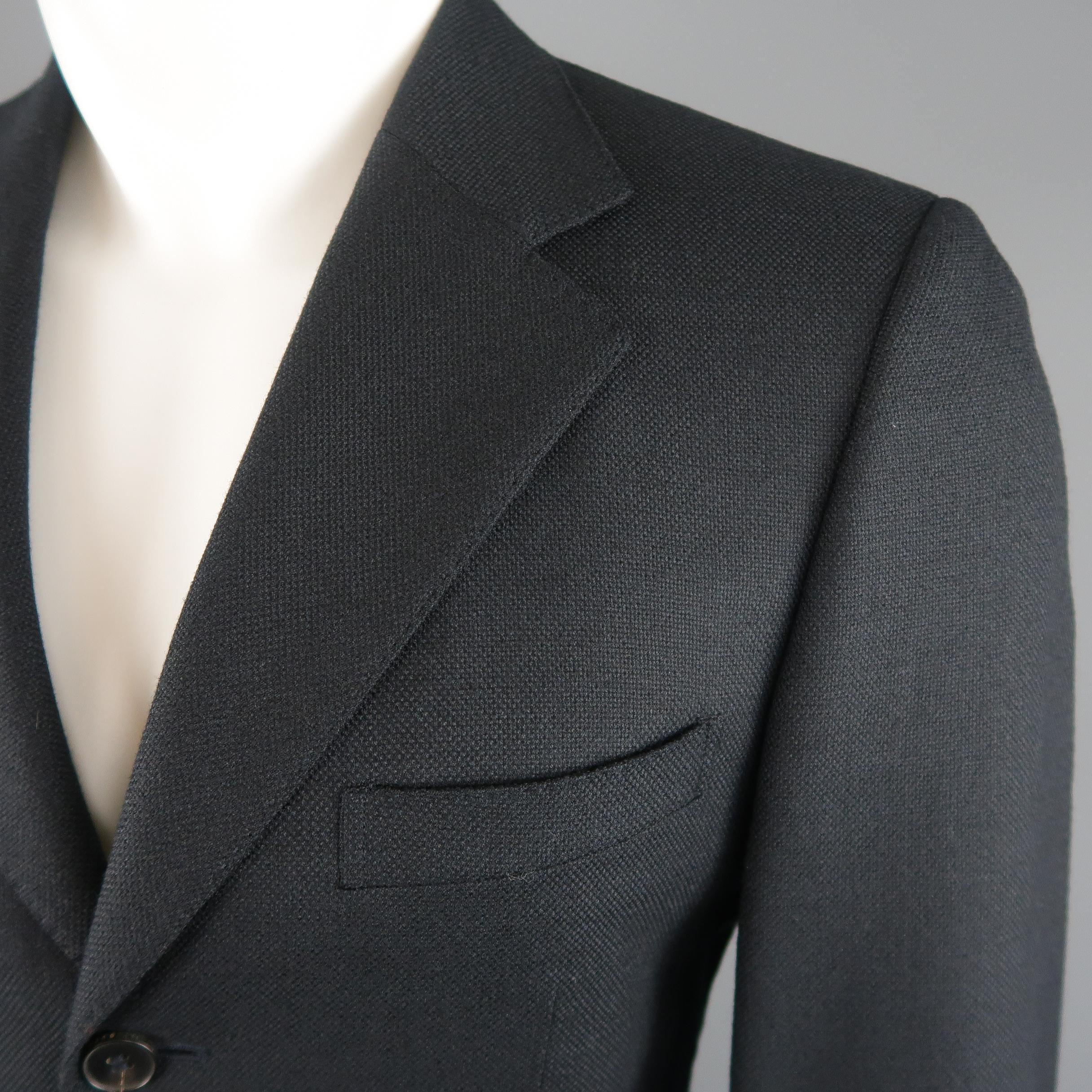 GUCCI sport coat comes in navy blue woven wool mohair with a notch lapel, notch three button closure, and single vented back. Made in Italy.
 
Excellent Pre-Owned Condition.
Marked: IT 46
 
Measurements:
 
Shoulder: 17 in.
Chest: 40 in.
Sleeve: 25