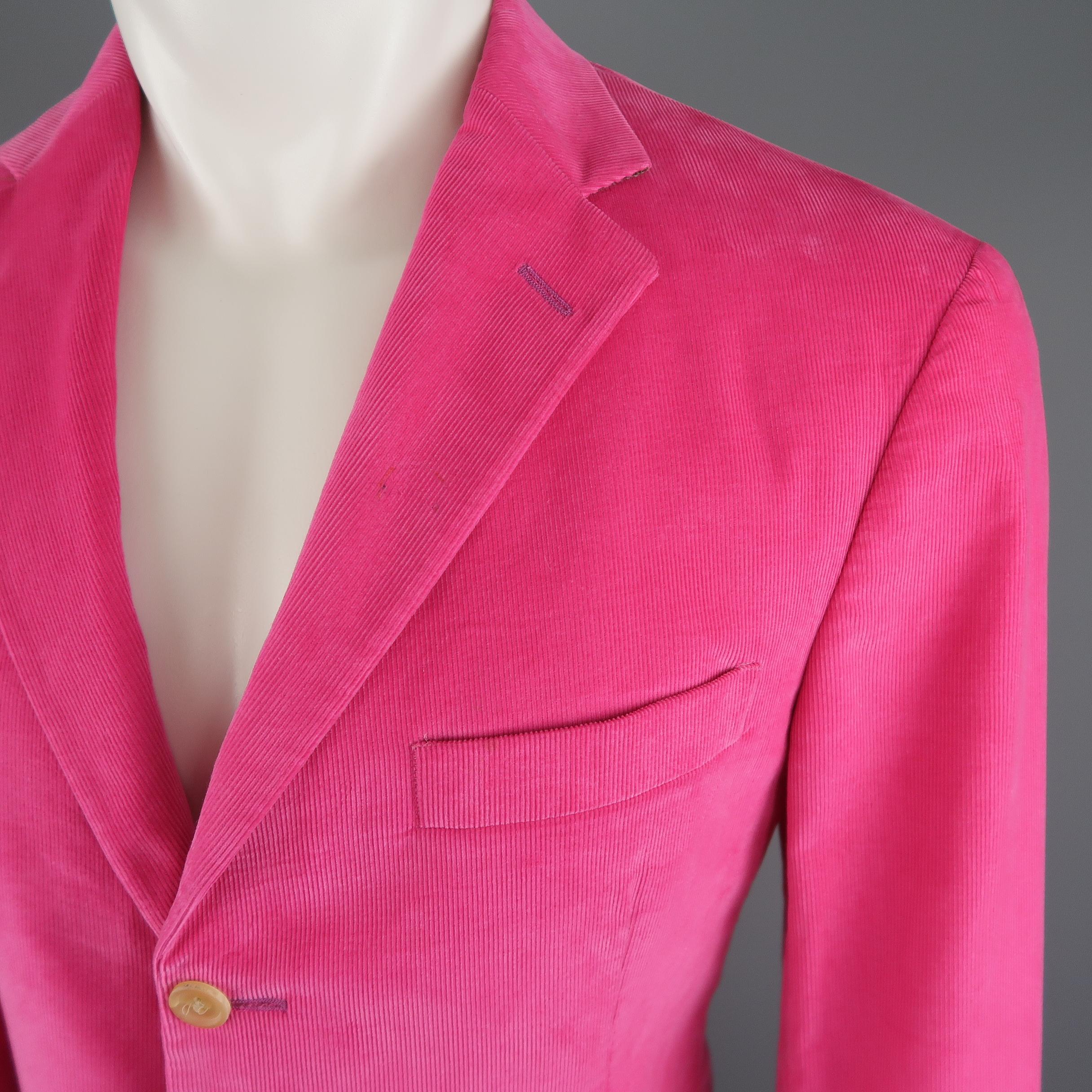 POLO RALPH LAUREN sport coat comes in fuchsia pink corduroy with a notch lapel, three button, single breasted front, and patch flap pockets. Small discoloration on lapel. Made in Italy. Retail price $ 1,200.00
 
Good Pre-Owned Condition.
Marked: M
