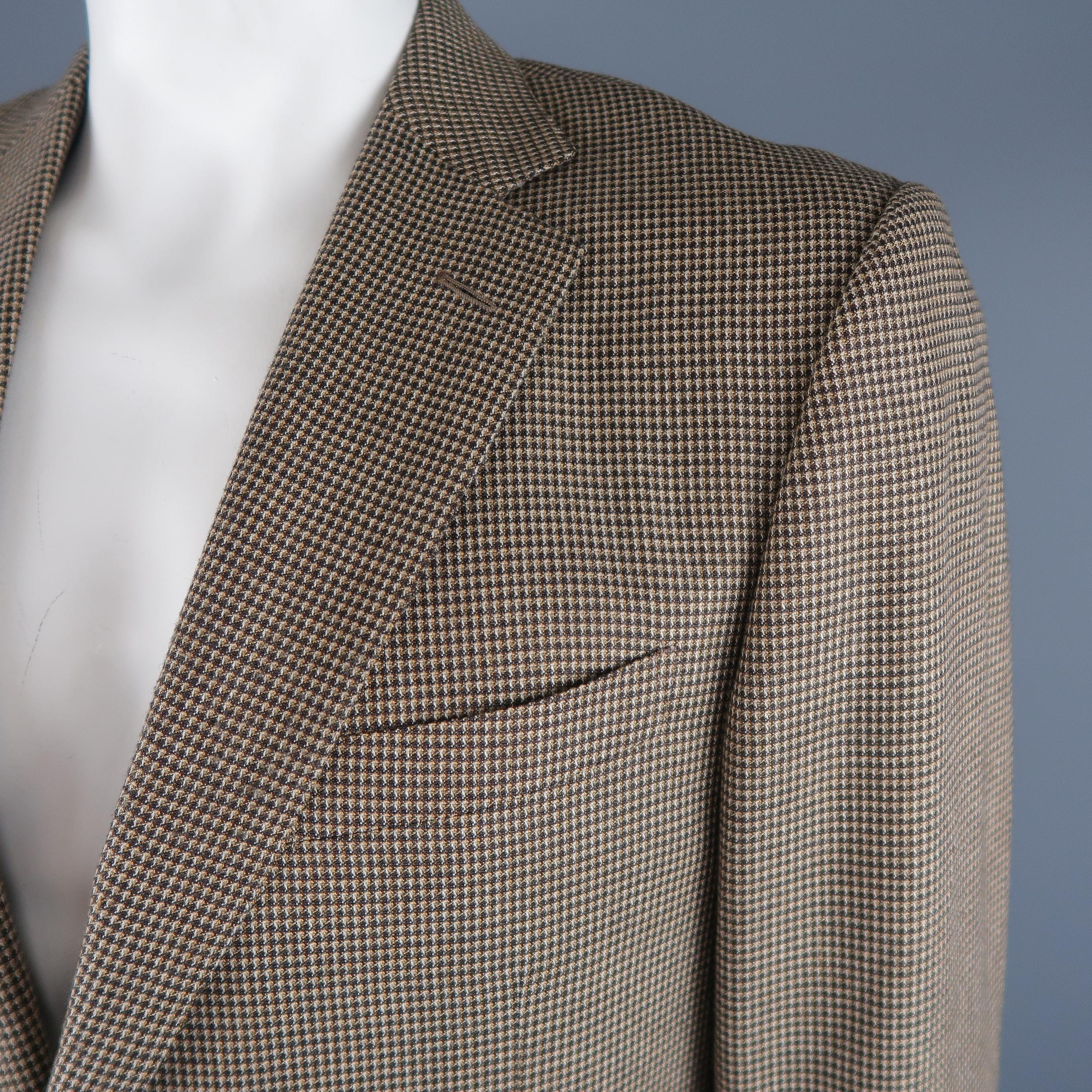 ERMENEGILDO ZEGNA sport coat comes in beige nailhead grid print silk cashmere blend with a notch lapel, with a two button single breasted closure, and double vented back. Made in Switzerland.
 
Excellent Pre-Owned Condition.
Marked: IT 54
