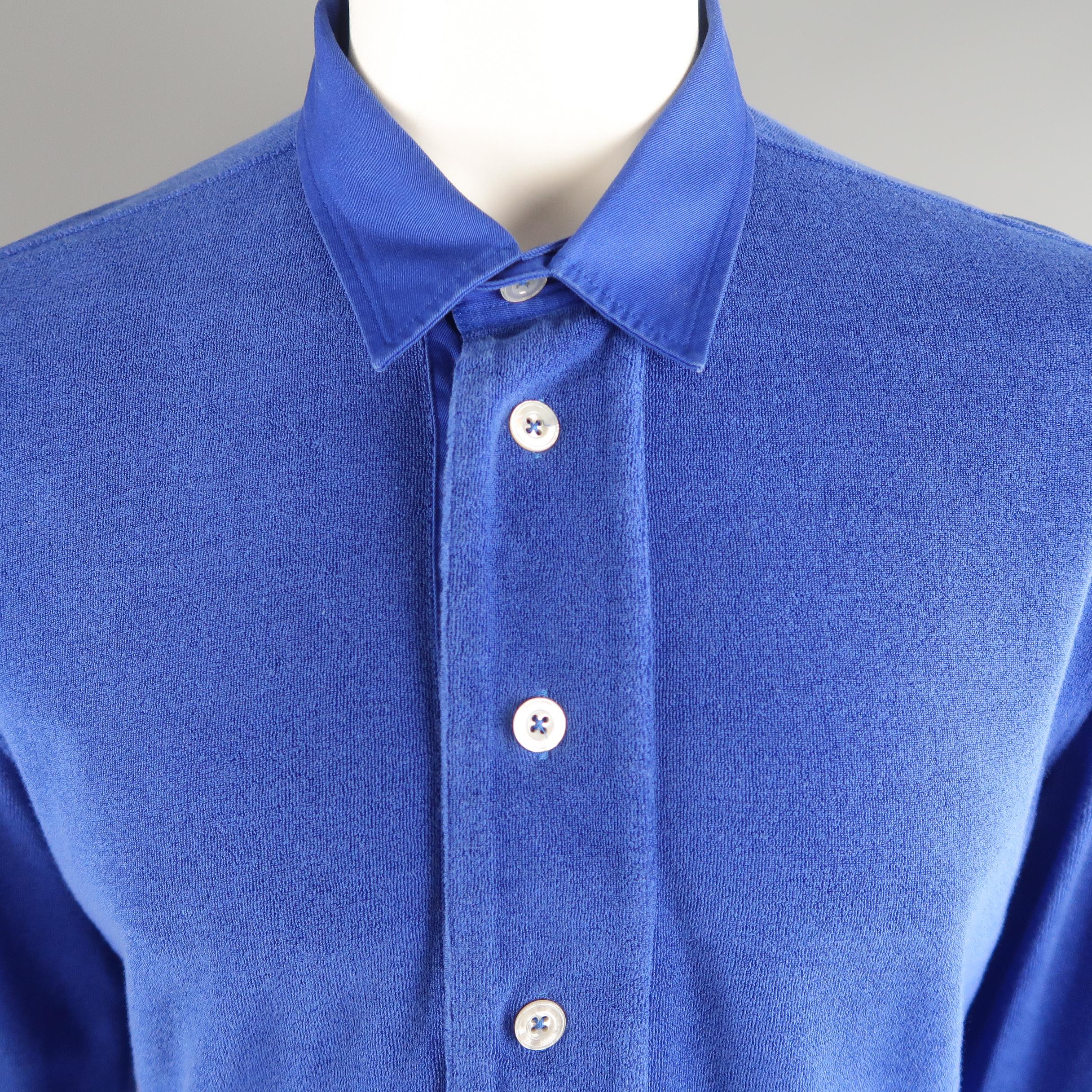 TOM FORD long sleeve POLO shirt comes in royal blue tone in terry material, half buttoned. Minor wear.  Made in Tunisia.
 
Good Pre-Owned Condition.
Marked: 54 IT
 
Measurements:
 
Shoulder: 18  in.
Chest: 46  in.
Sleeve: 28.5  in.
Length:  29  in.