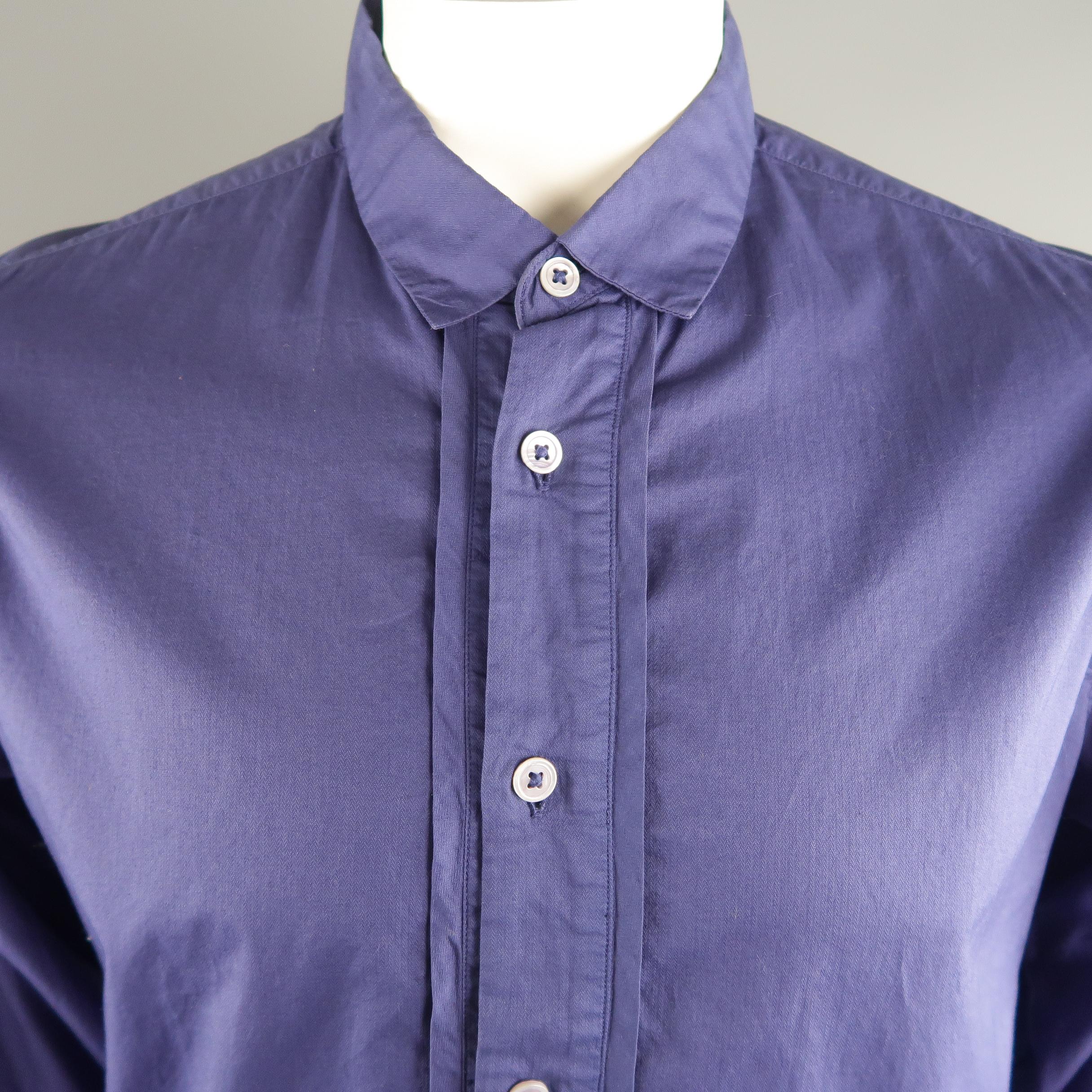 ANN DEMEULEMEESTER long sleeve shirt comes in purple tone in a solid cotton material, with a detailed closure, small collar and French cuffs. Light ironing marks at collar. Made in Tunisia.
 
Good Pre-Owned Condition.
Marked: XL
 
Measurements:
